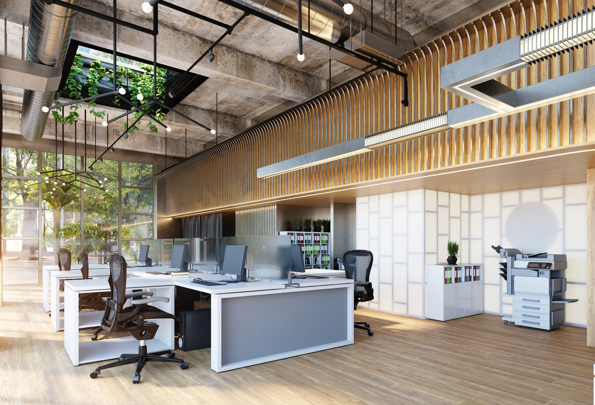 Modern office space with white desks, black office chairs, desktop computers, a large window with green plants outside, and stylish wooden and concrete decor.