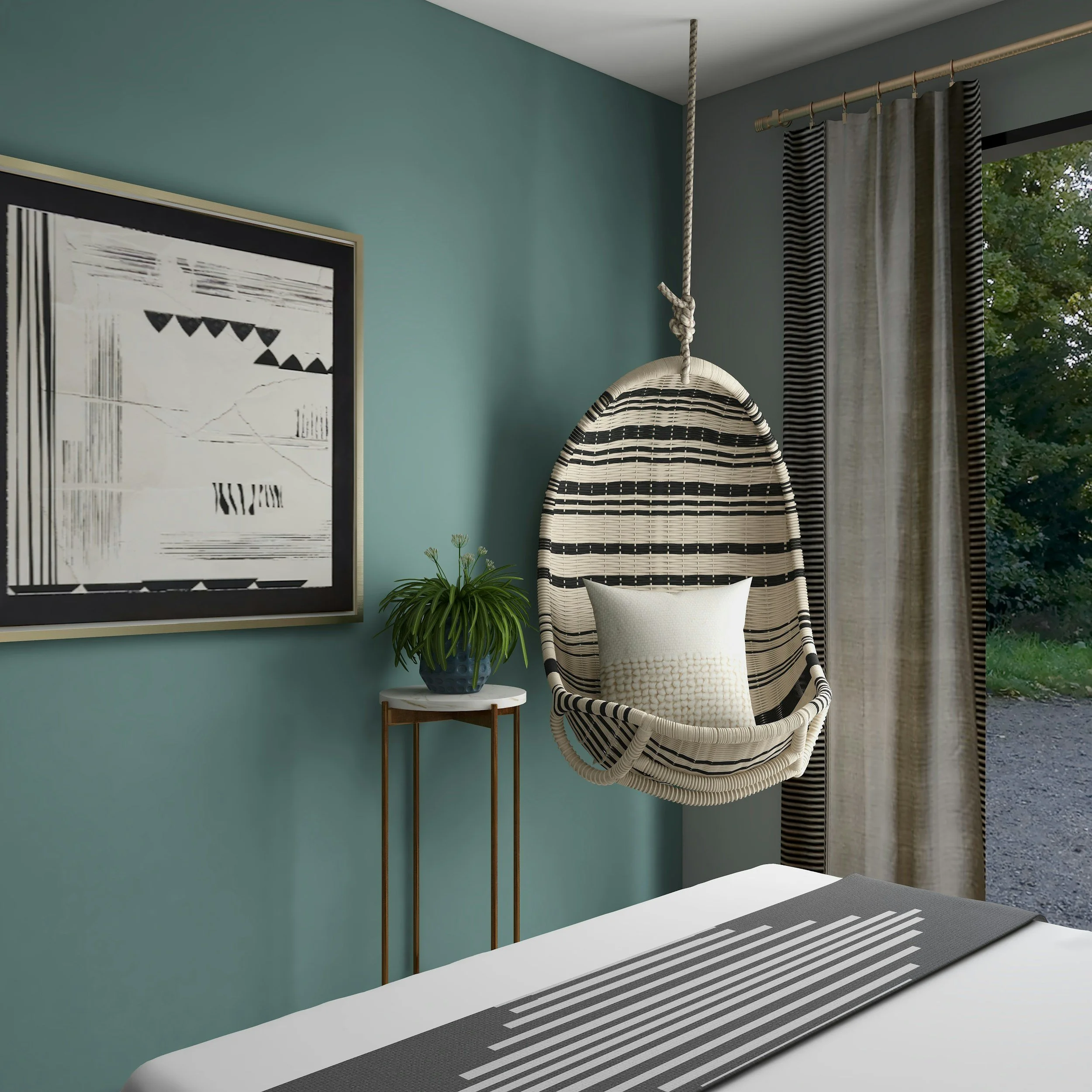 A cozy corner with a hanging rattan egg-shaped chair with black and white stripes, a pillow inside, a small side table with a potted plant, a teal wall with a black and white abstract picture, and a window with beige and black striped curtains showing greenery outside.