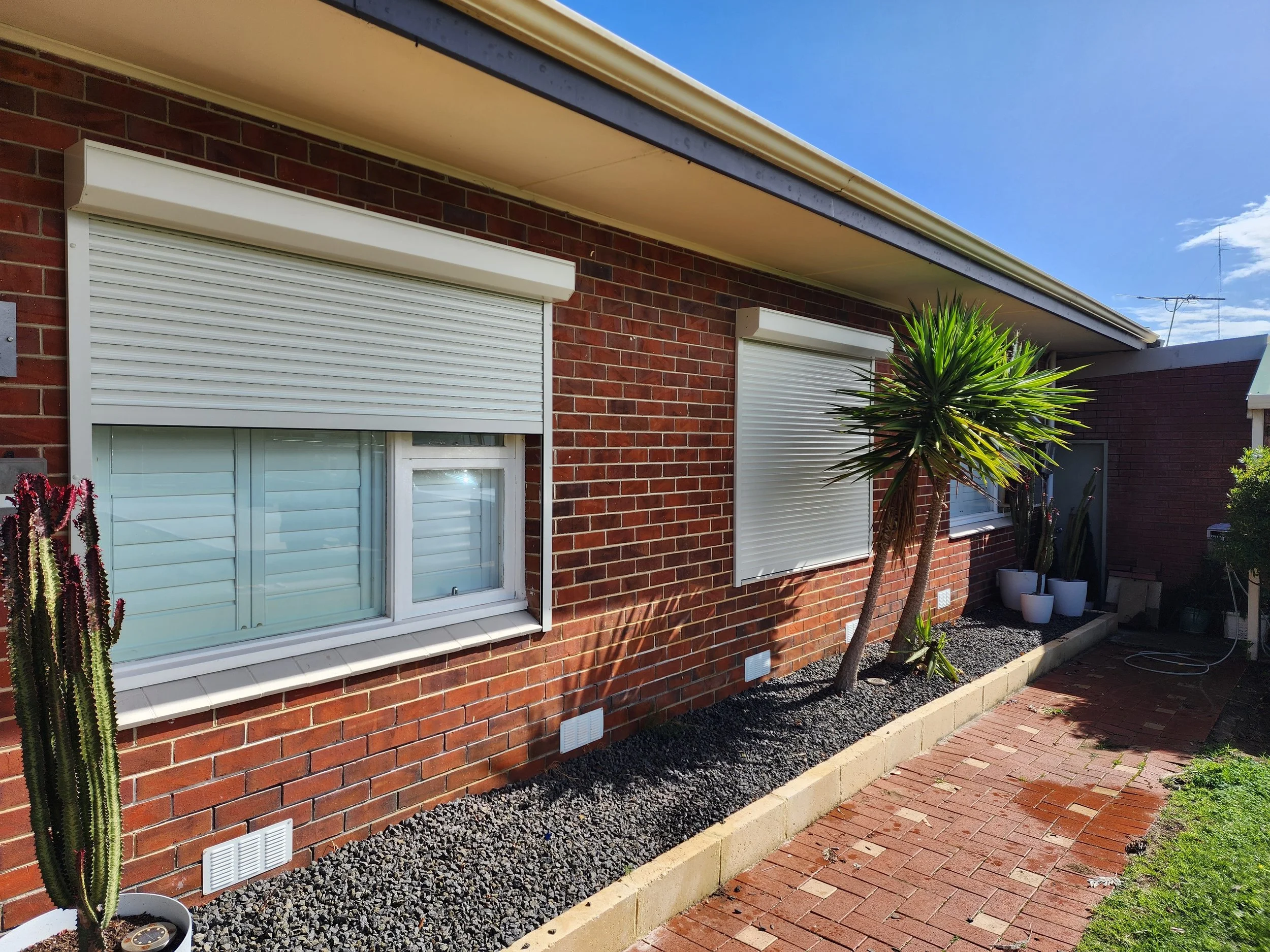 Surfmist window Roller shutters installed on a Bunbury home for protection against noise, Morning sun and heat. Perfect for the shift worker client
