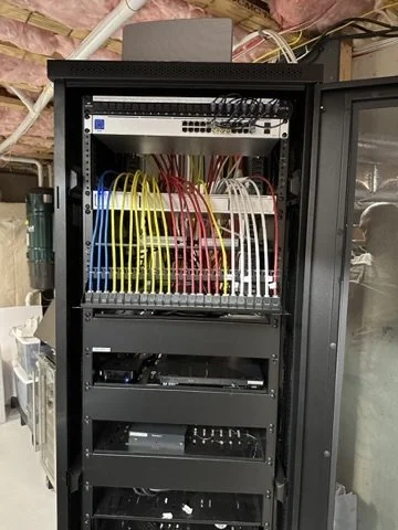 Patching Cat6 cables into a patch panel for a reliable network.