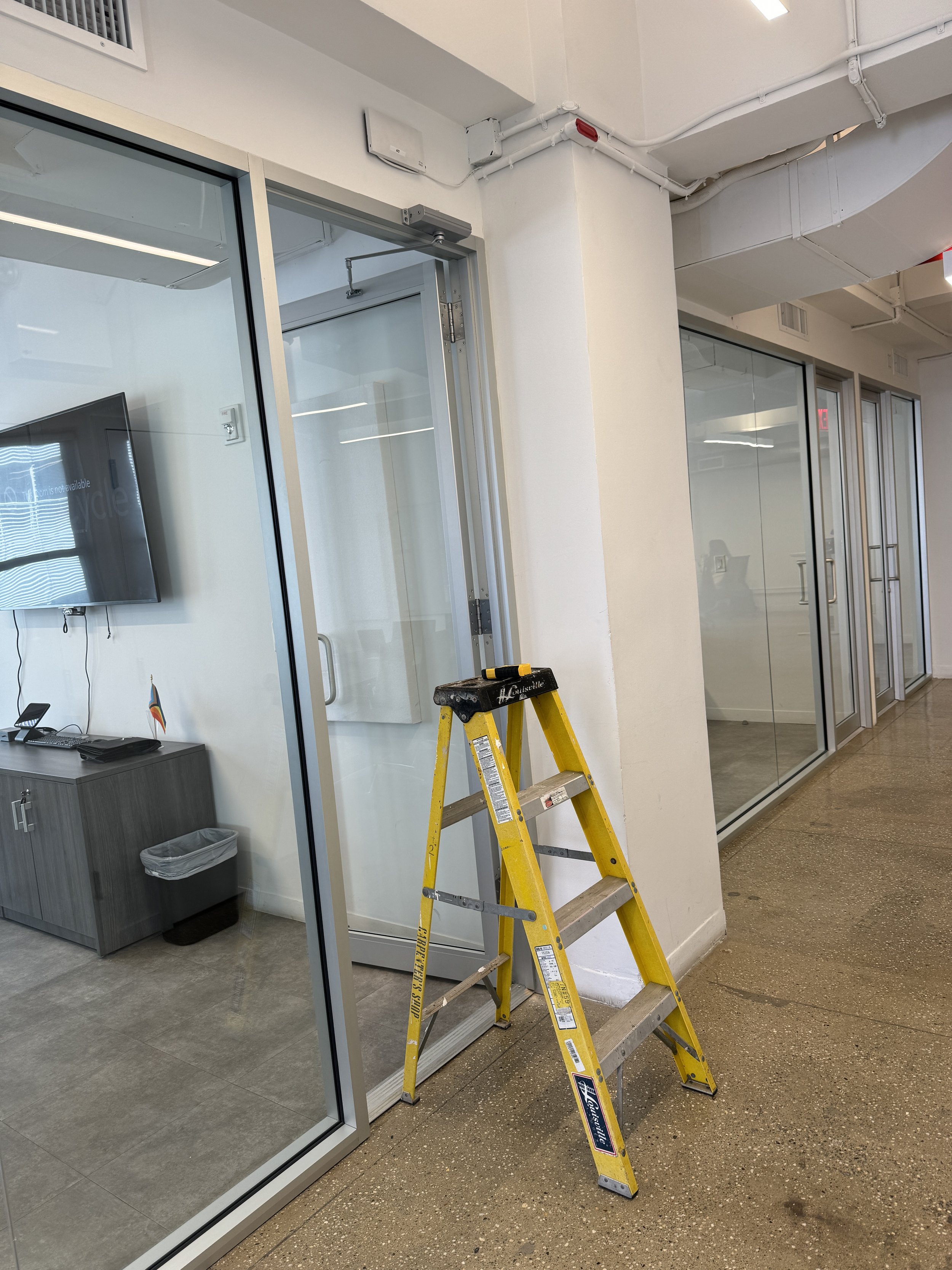 Mounting Meraki access point outside a conference room.