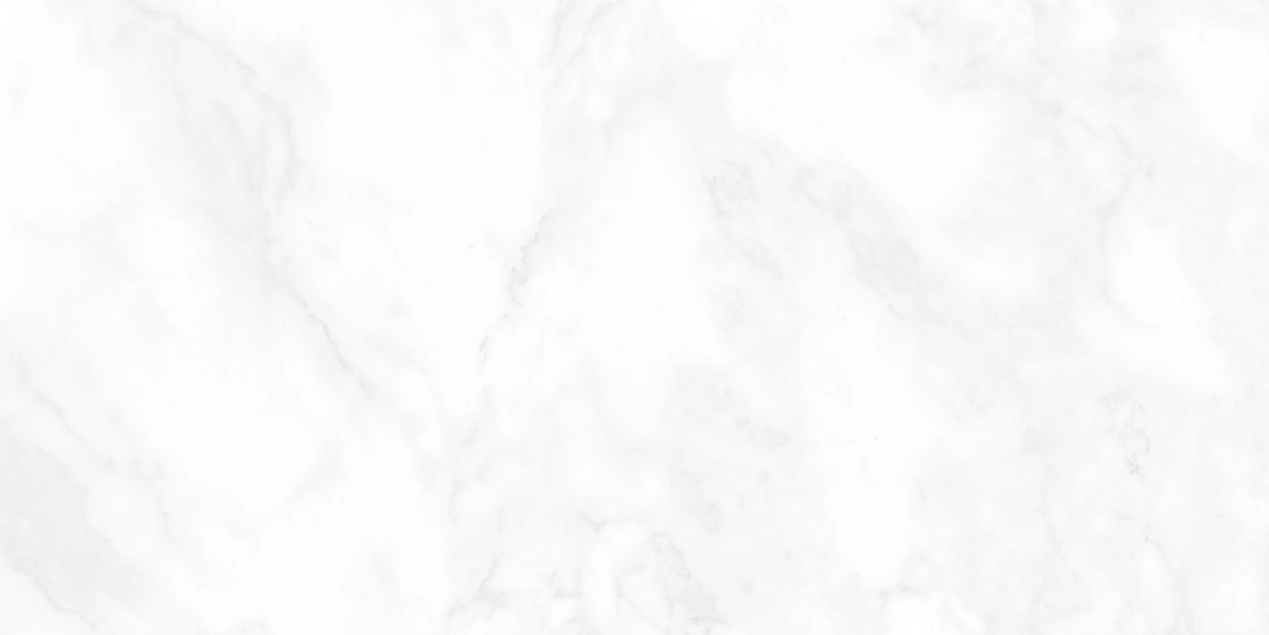 A blank white marble surface with subtle gray veining.