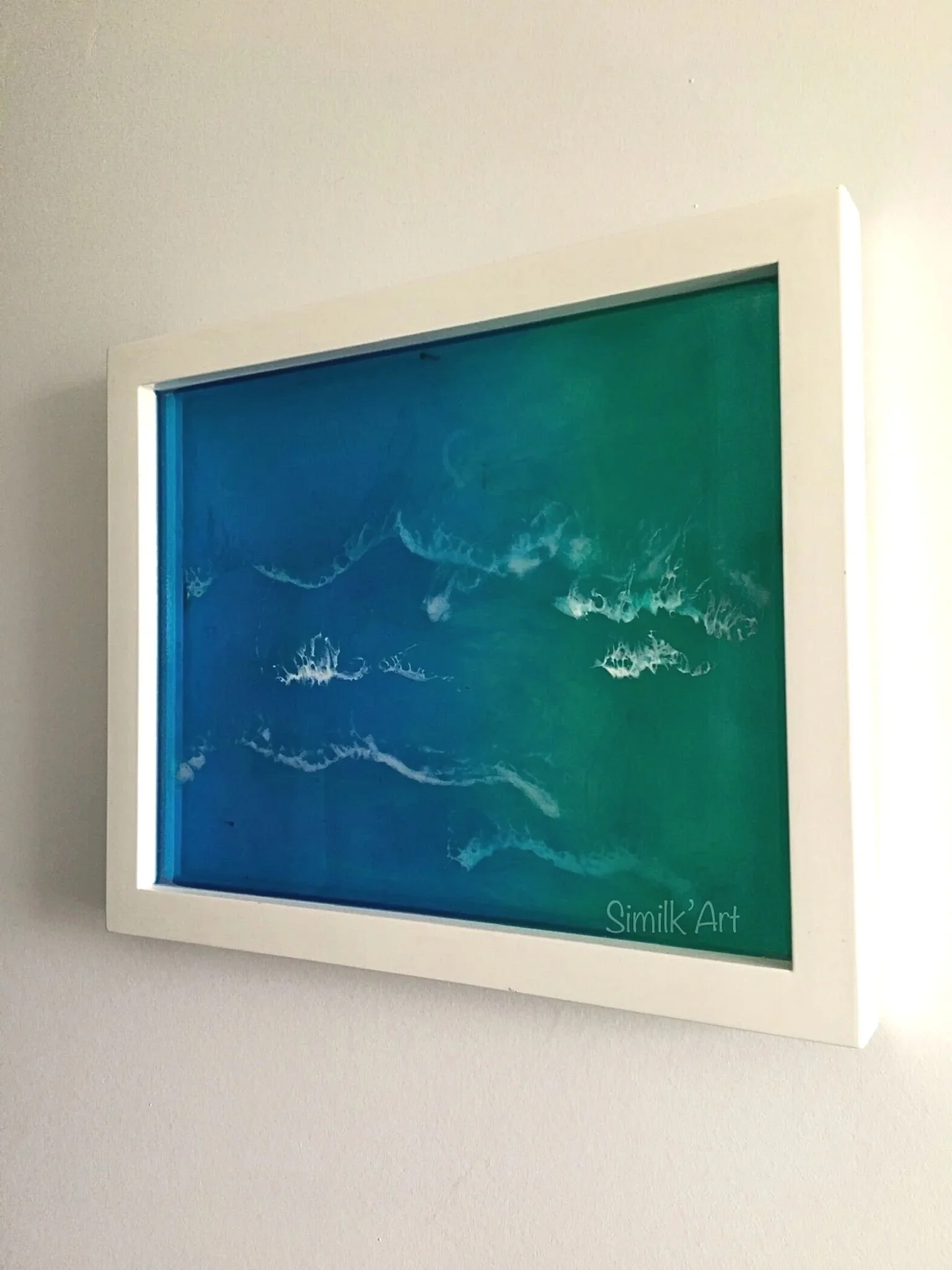 Wall Art Resin piece depicting the crystal-clear blue water of the ocean in shades of blue and green, with very subtle white waves