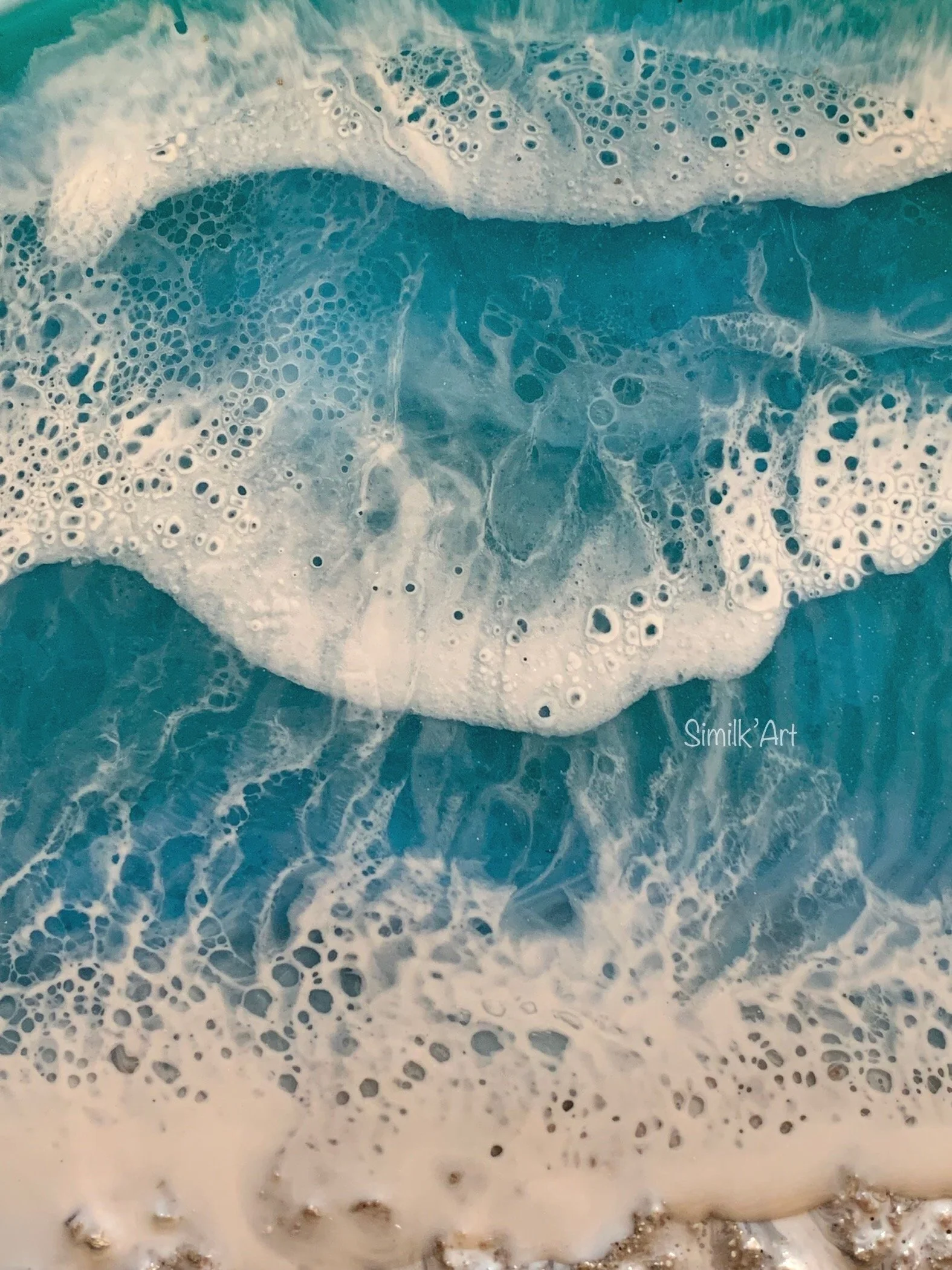 Close-up of a painted ocean wave with white foam and bubbles in shades of blue and white.