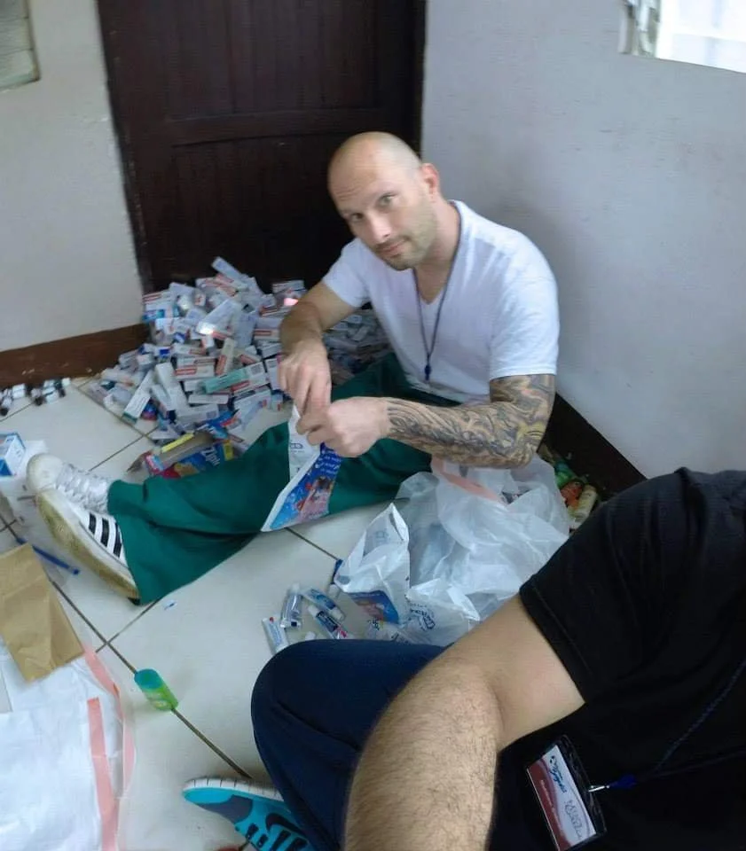 Healthier Futures International volunteer sorts donated medications for 2015 free healthcare mission