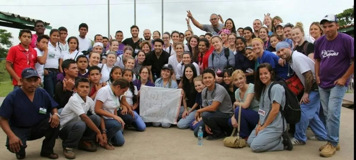 Healthier Futures International volunteer team and community members pose for a group photo during 2015 mission