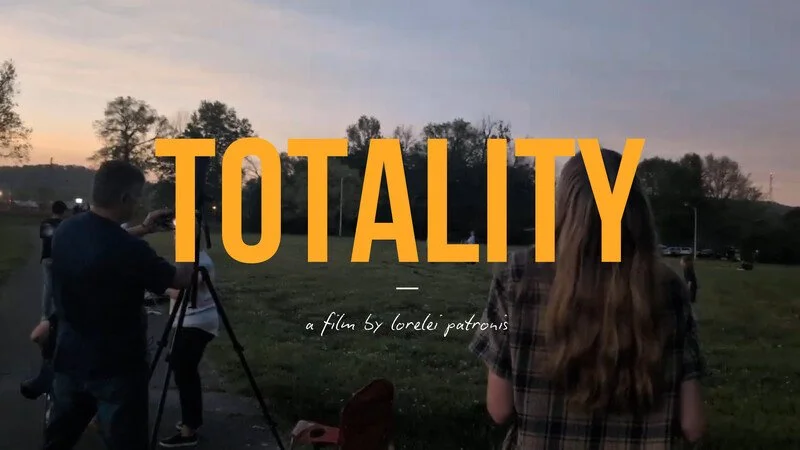 Yellow words spell out 'Totality'