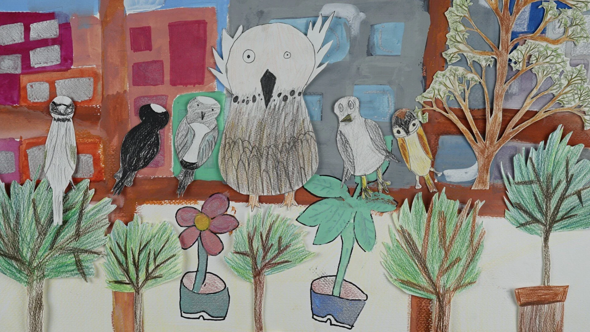 A child's drawing of birds on a tree branch