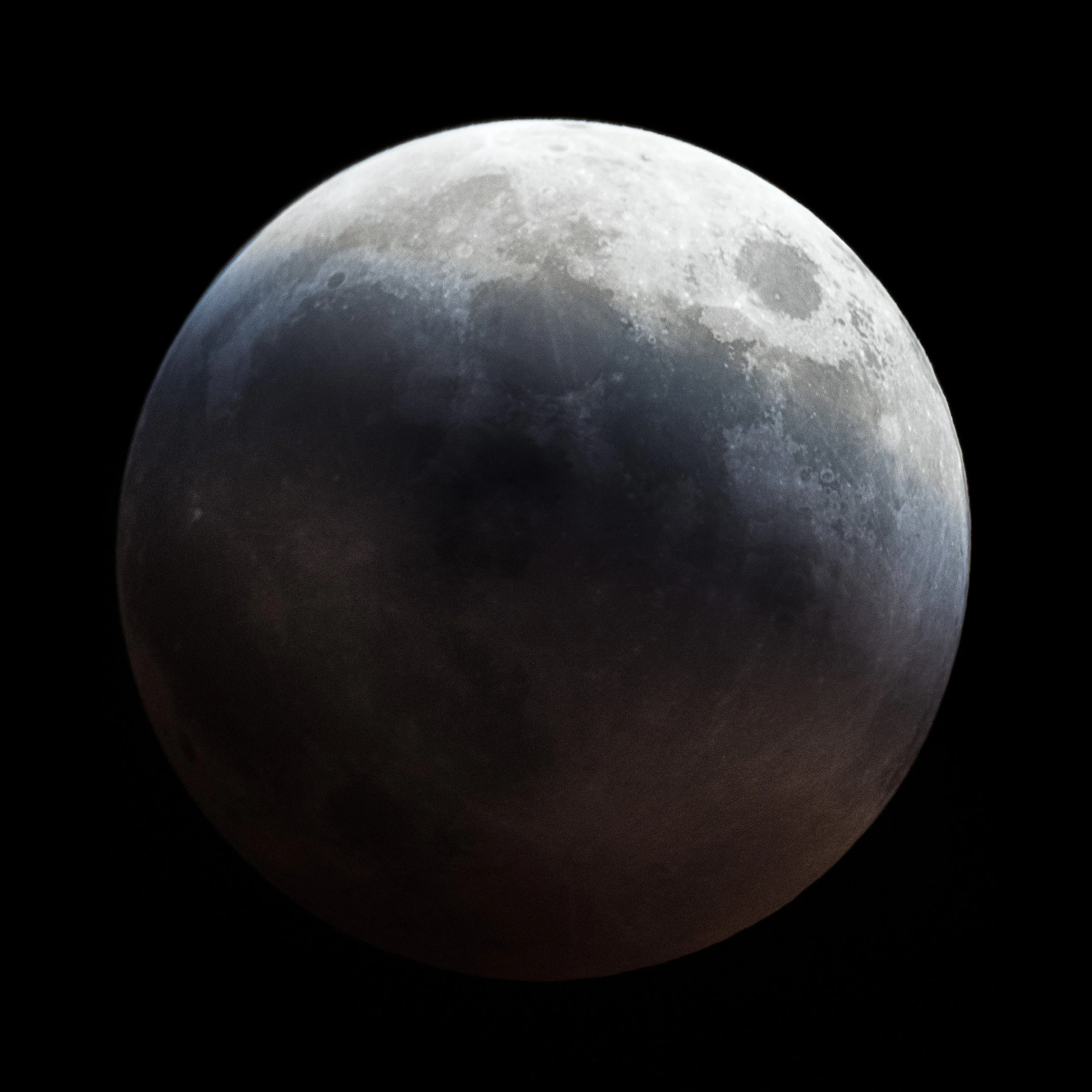 Close-up image of the moon showing its craters and surface details against a black background.