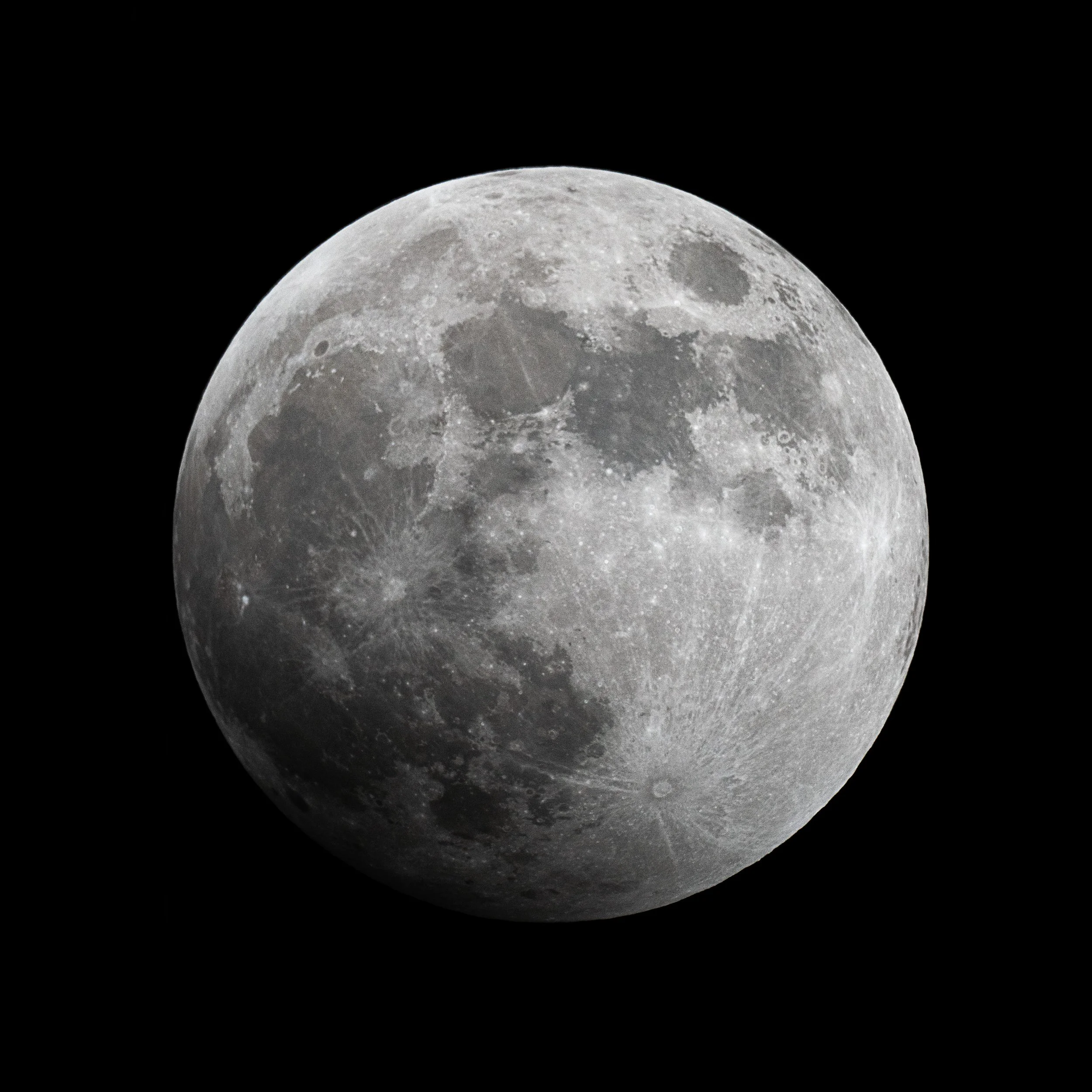 Full moon with visible craters against black night sky