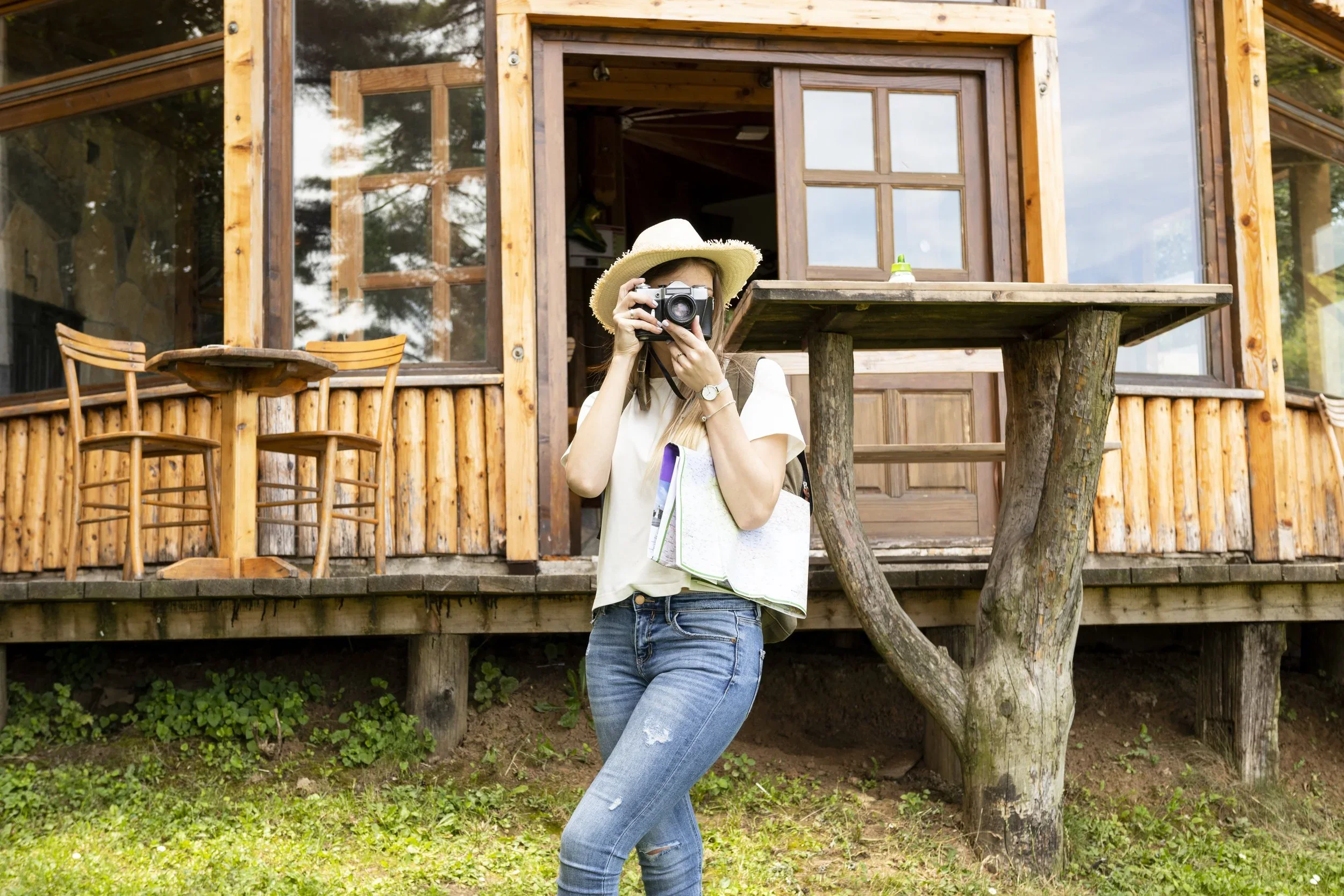 woman-taking-picture-front-house.webp