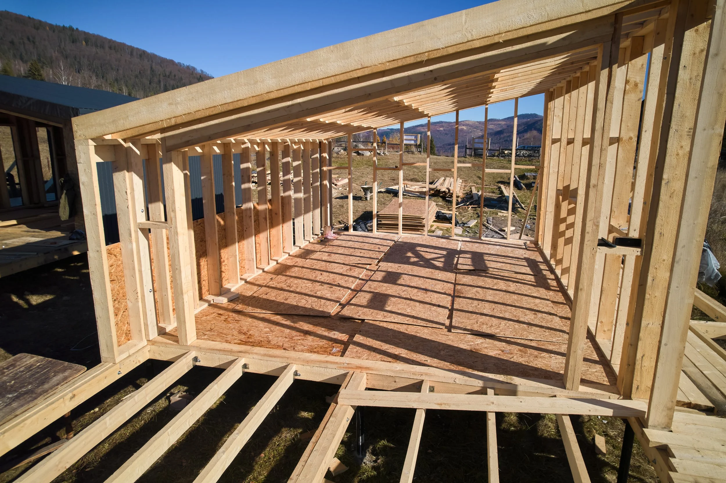 timber-frame-house-pile-foundation-construction-mountains.jpg