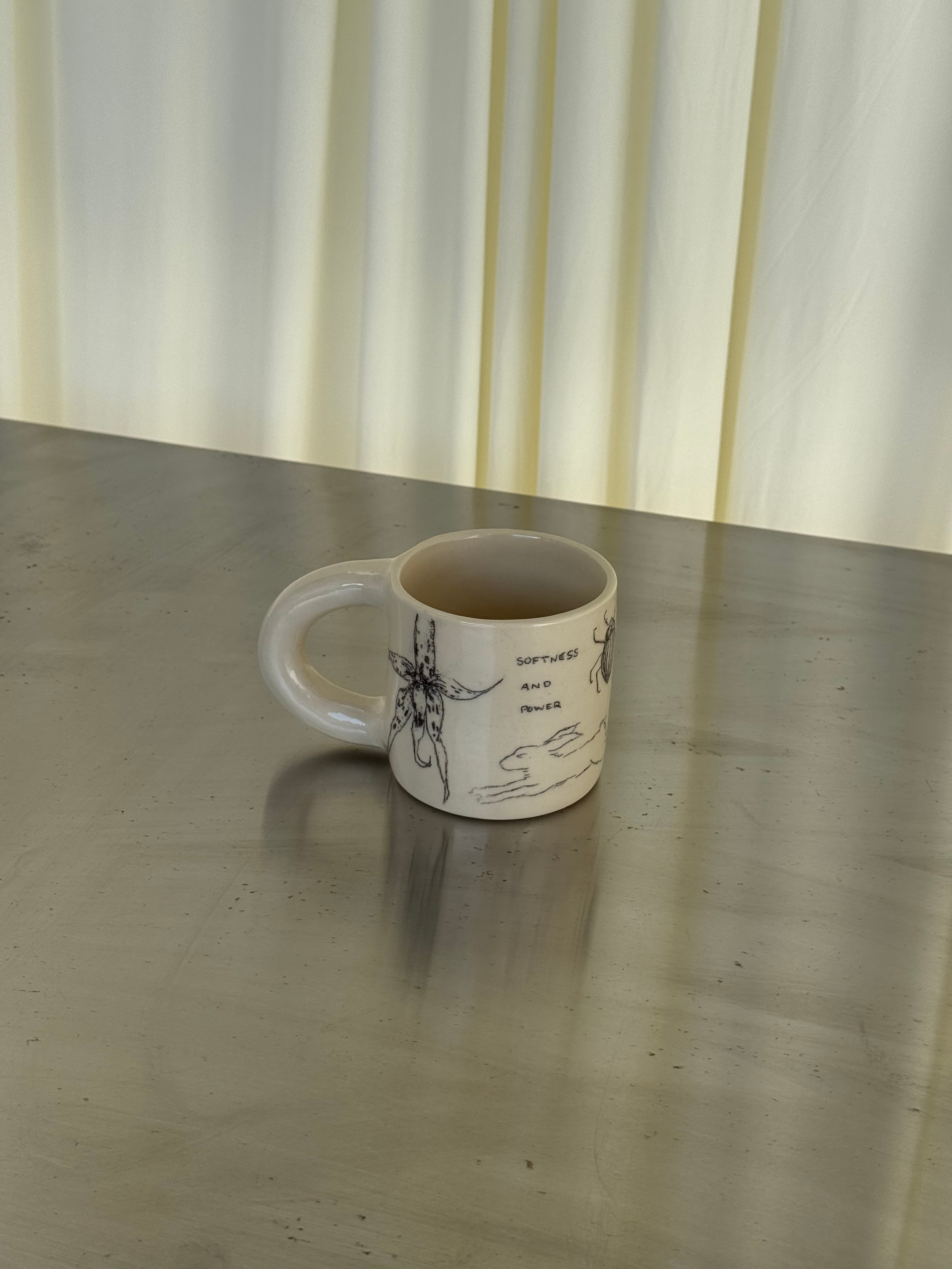 softness and power: doodle mug (cream)