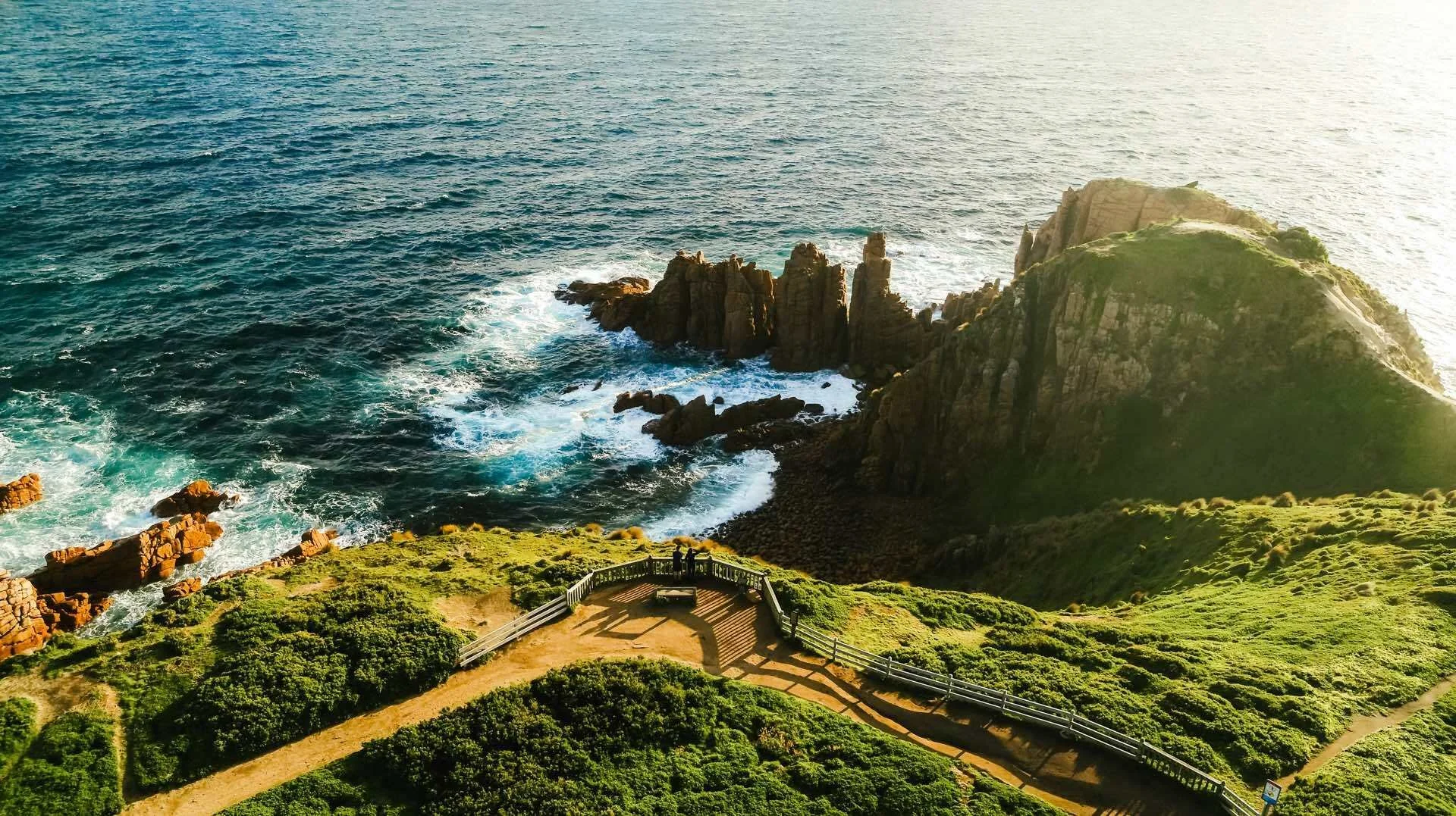 epic image of the coast line, with walking track and seating area to take in the scenery. one of the many nature walks available on Phillip Island