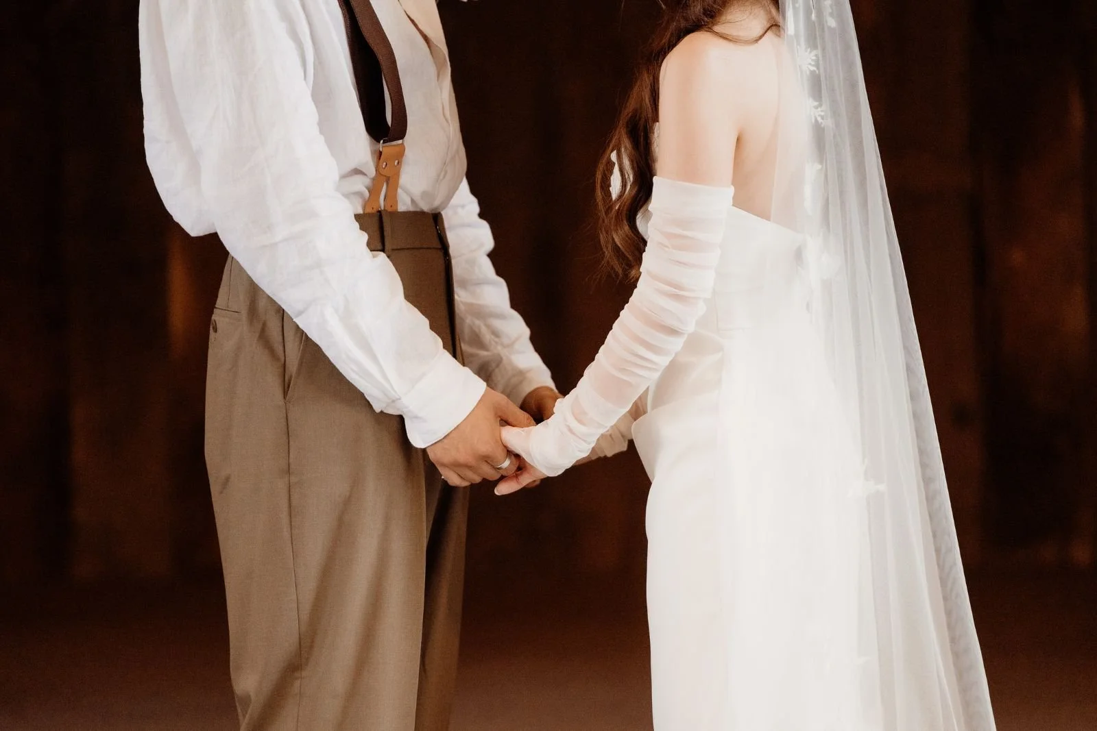 Bride and Groom holding hands during ceremony in The Barn at The Shearing shed Phillip Island, Victoria