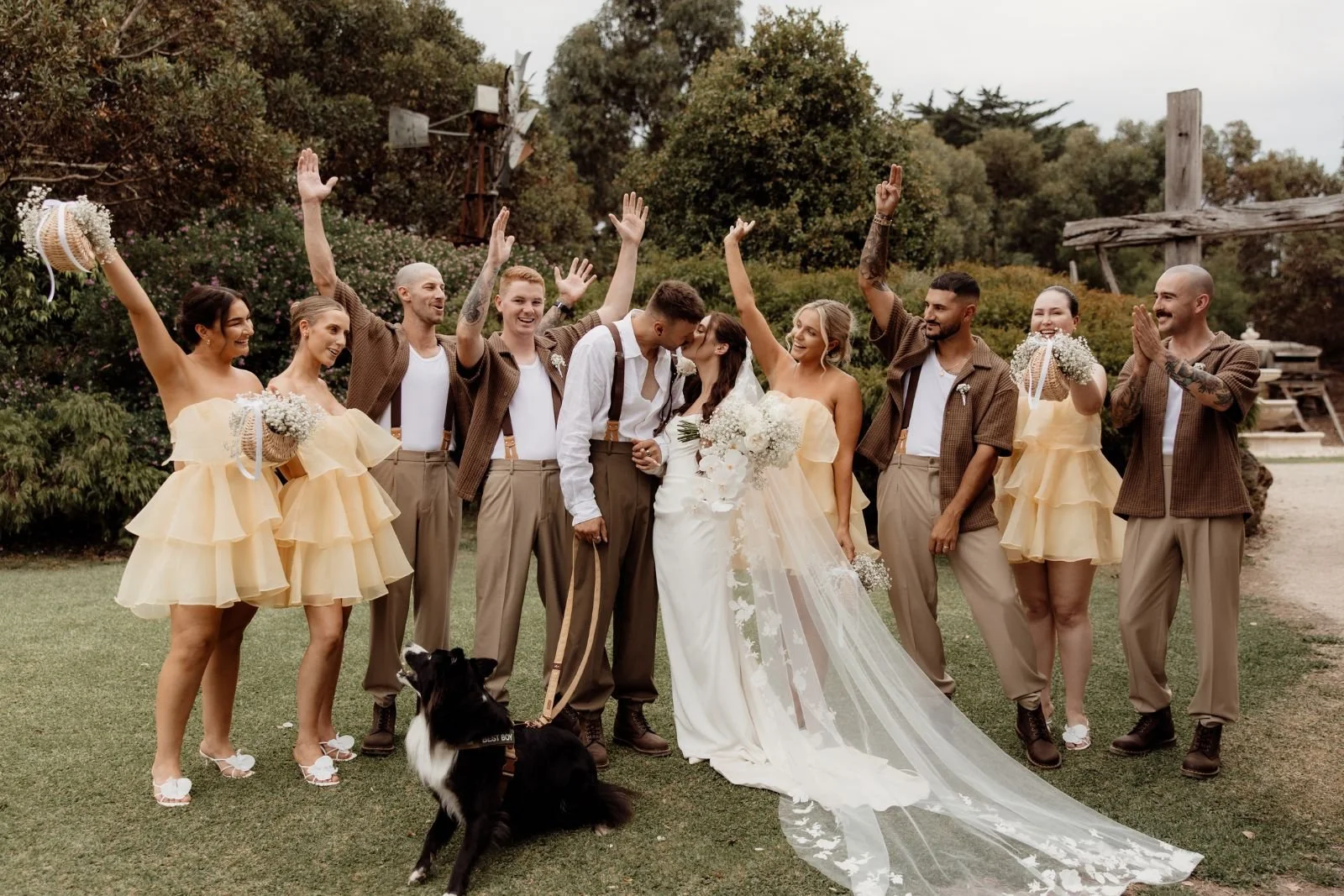 Bride and groom celebrate with their wedding party and dog at The Billabong at The Shearing Shed Phillip Island