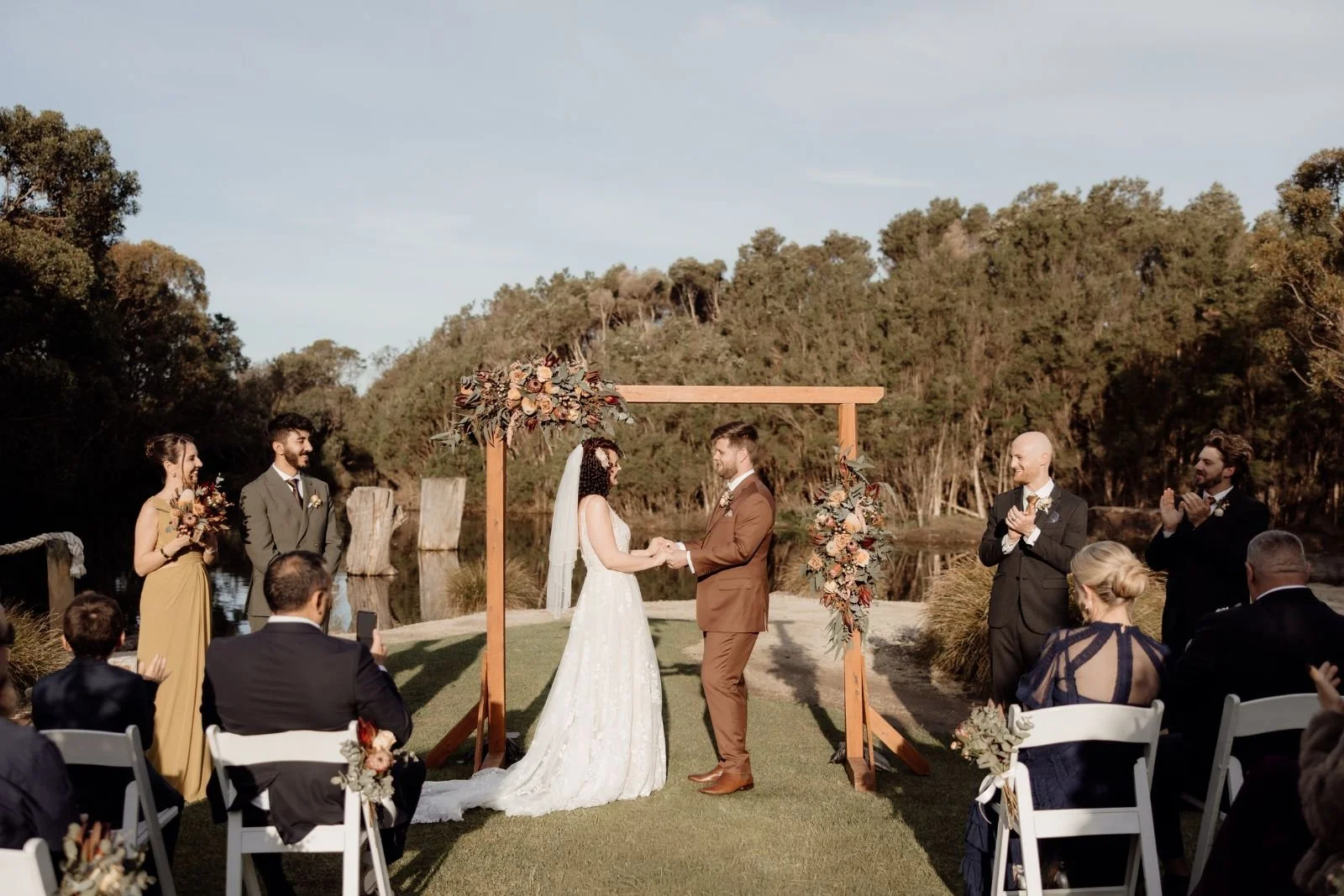 wedding ceremony by the water at The Billabong at The Shearing Shed Phillip Island