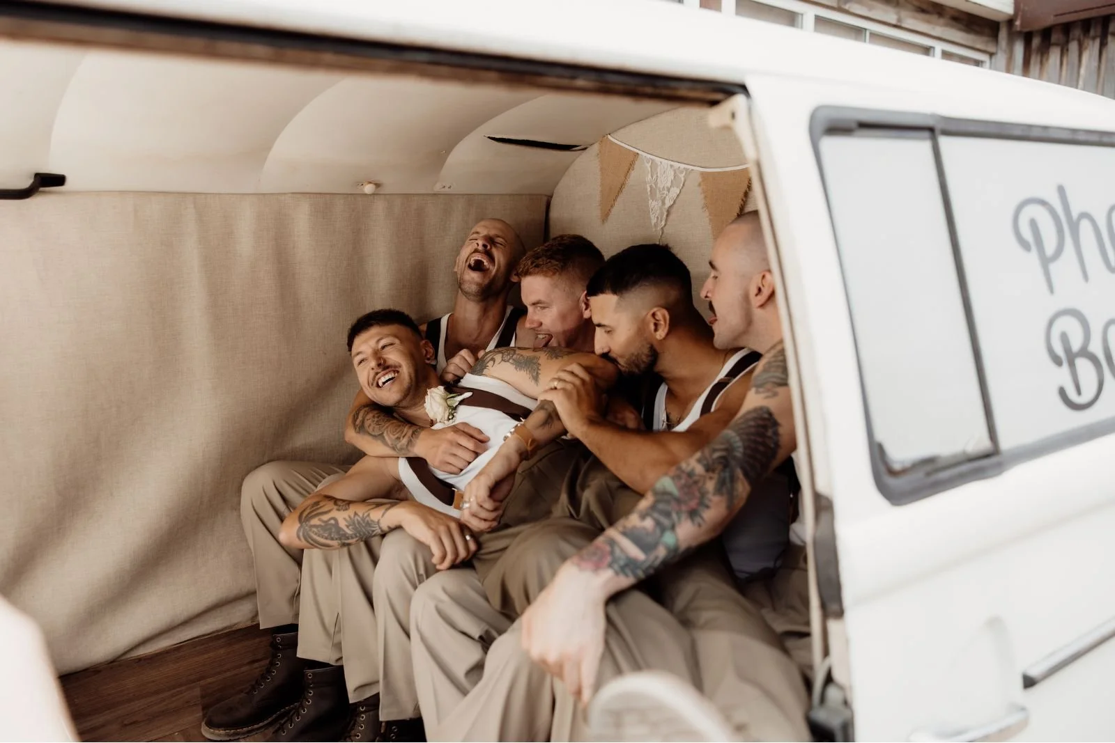 Groom and Groomsmen having fun in the Kombi Photobooth at The Shearing Shed