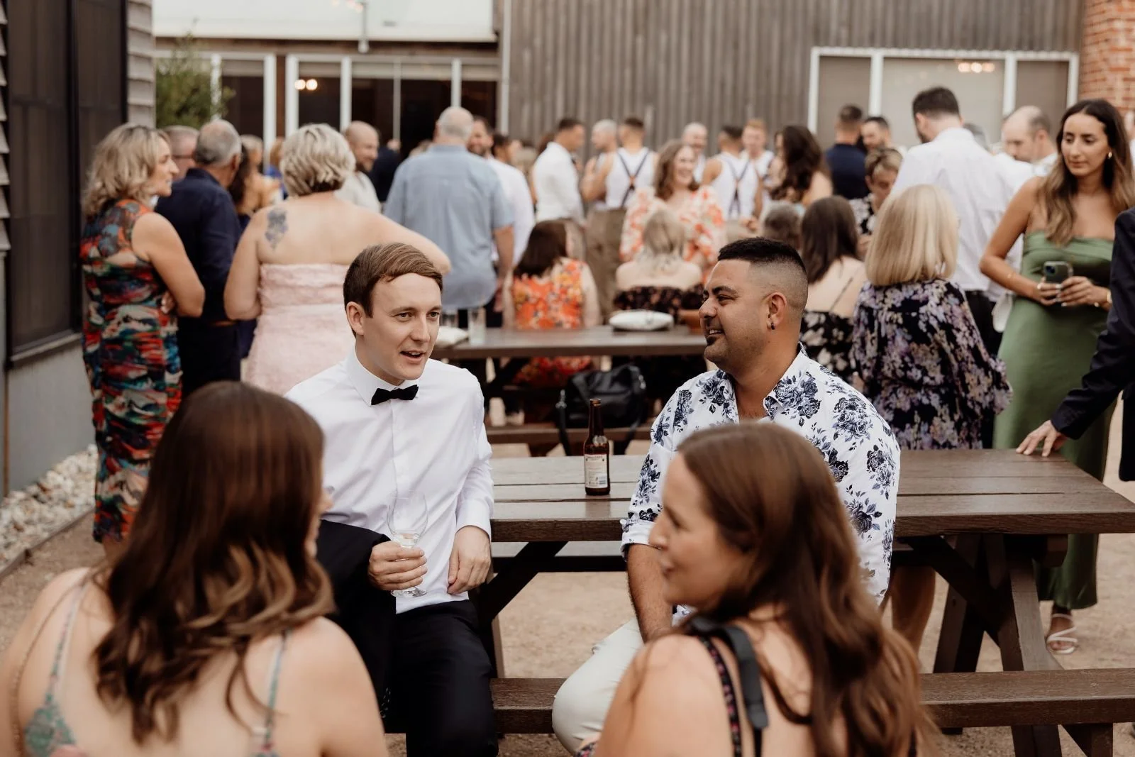 guests mingle in the courtyard at The Shearing Shed Phillip Island