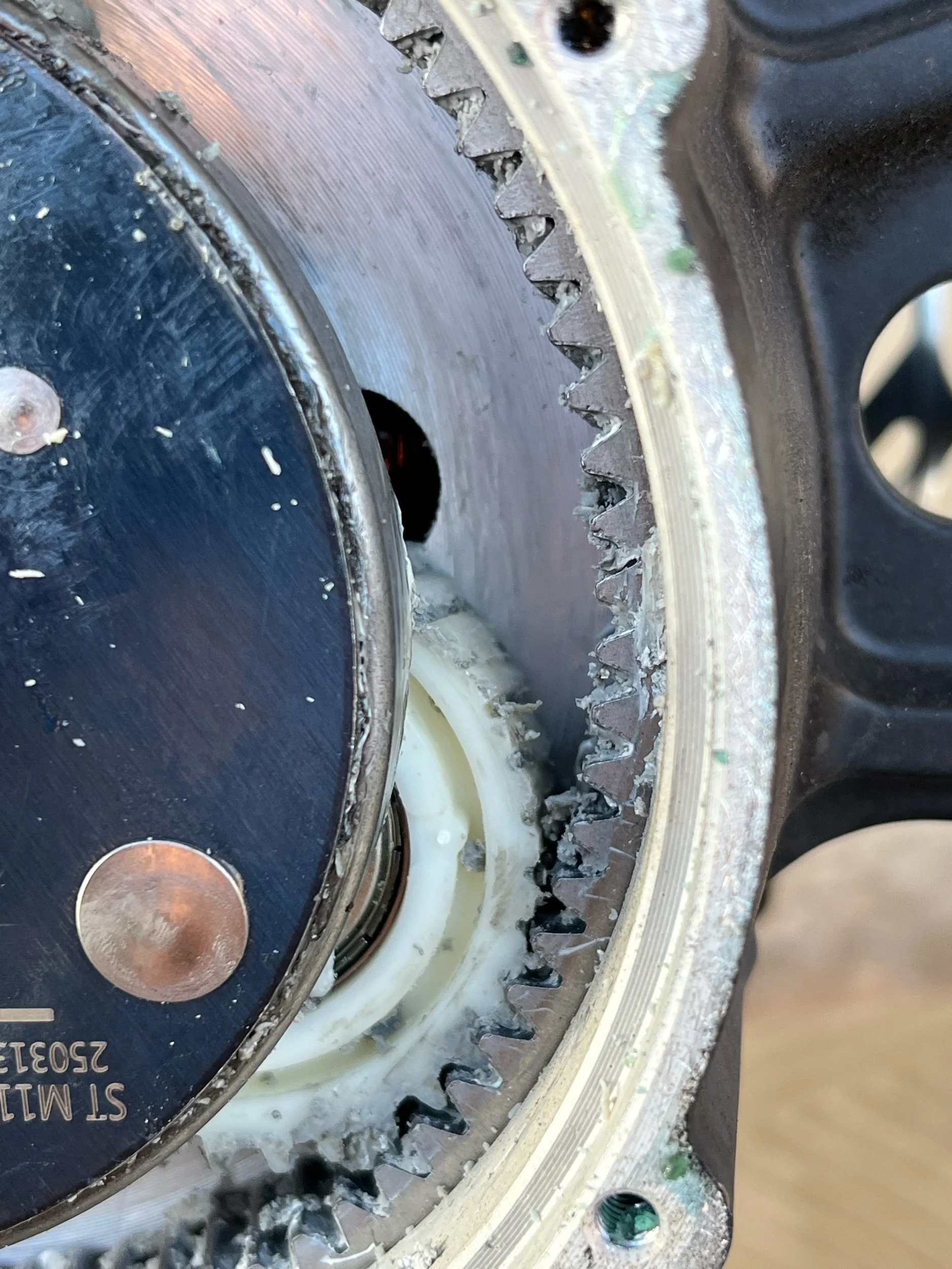 Close-up of a large gear or rotor with visible teeth, part of a mechanical or industrial device.