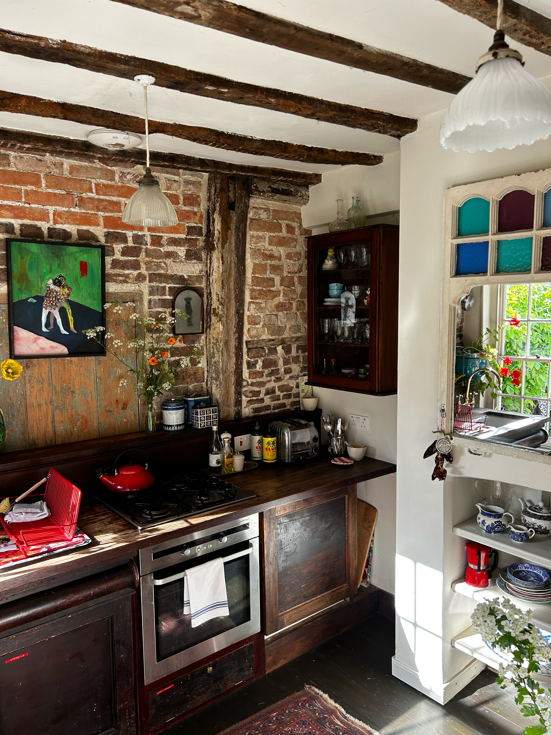 Visually striking reclaimed kitchen with reclaimed elements, vintage styling and unique interiors at Dot Cottage, Rye East Sussex 
