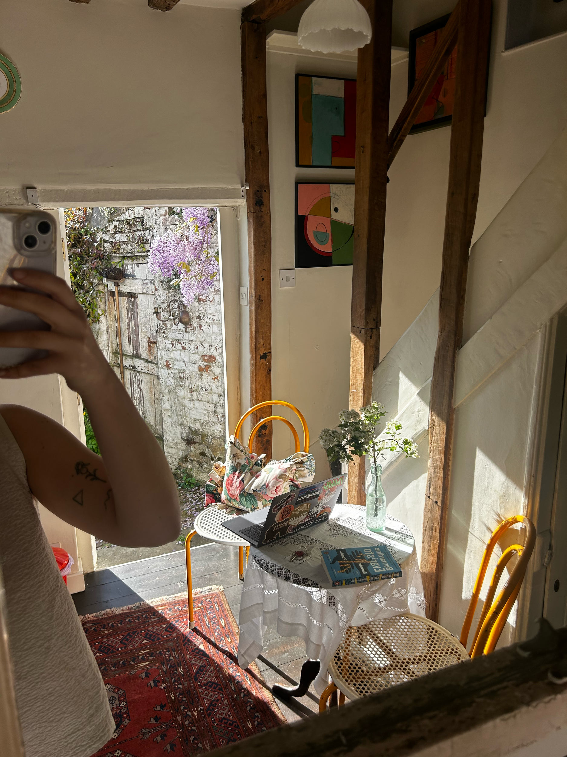 Afternoon sunlight streaming onto the kitchen table at Dot Cottage creating and inspiring work-from-home setting with cottagecore charm