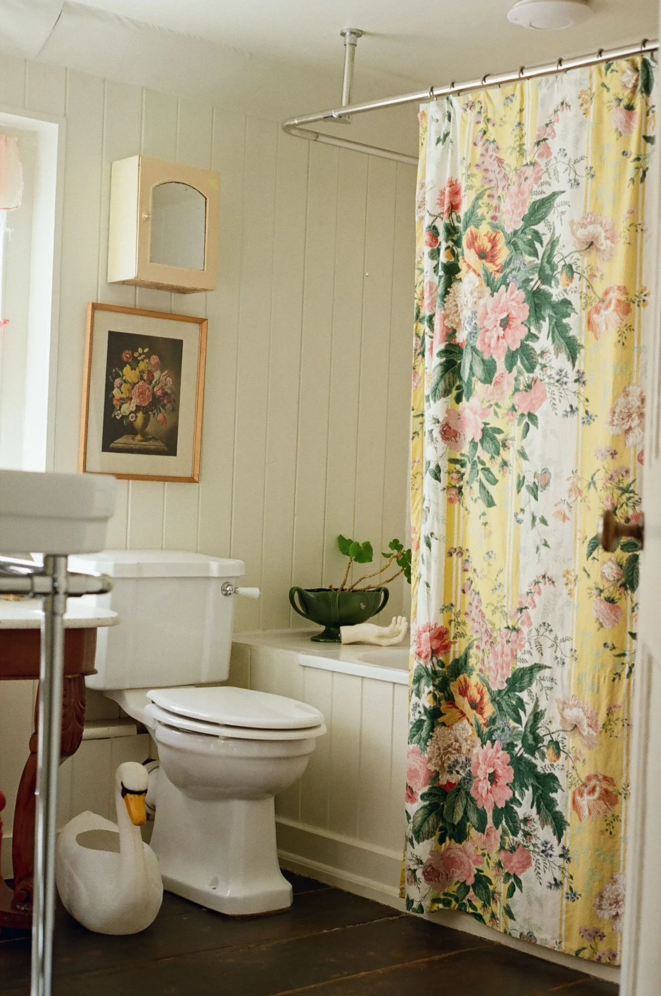Beautifully styled cottage bathroom at Dot Cottage Rye featuring vintage inspired details, chintz fabric, soft tones and timeless English cottage interiors.

