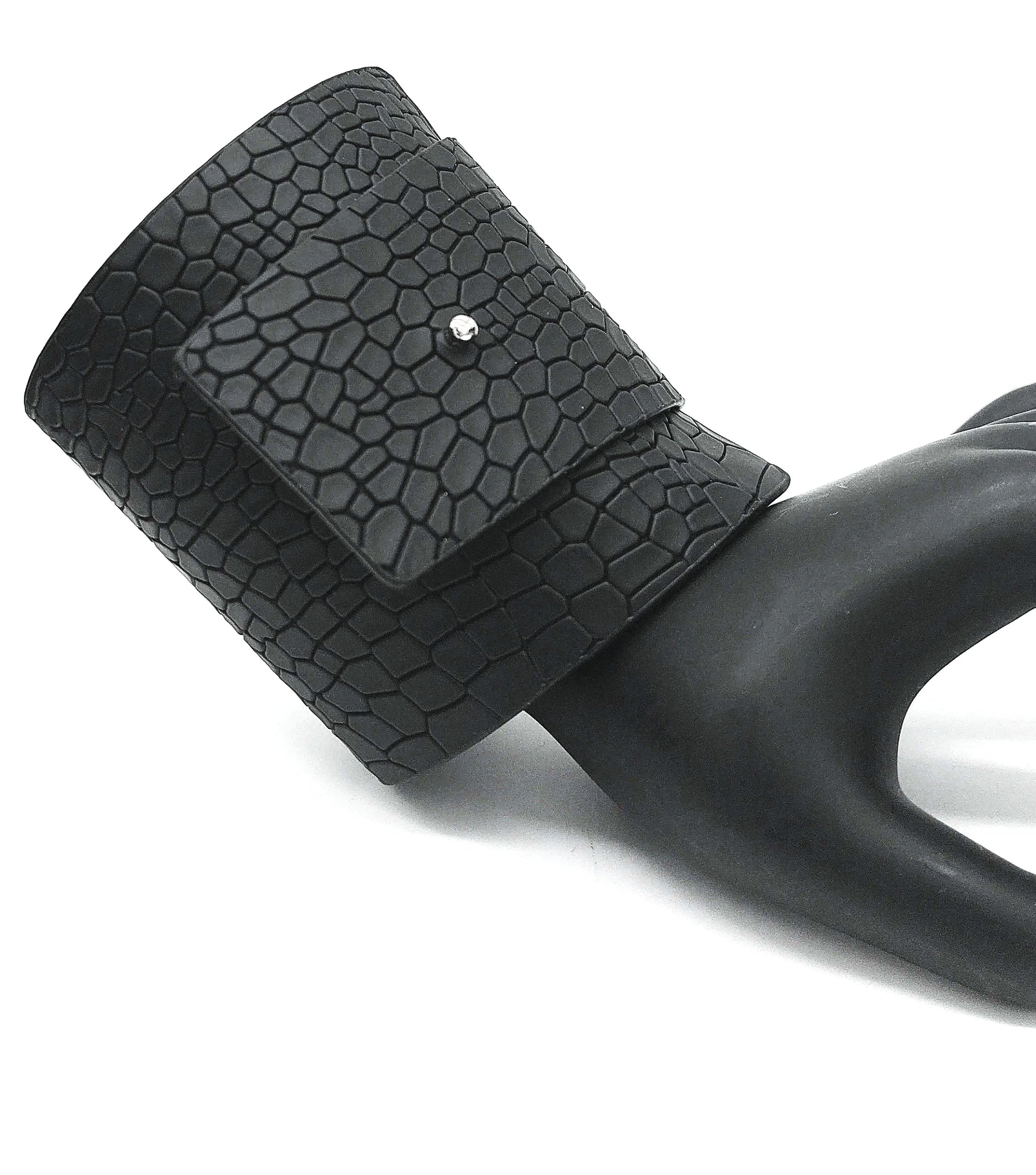 Black handheld device with a textured surface and a small metallic detail on the top, attached to a black handle.