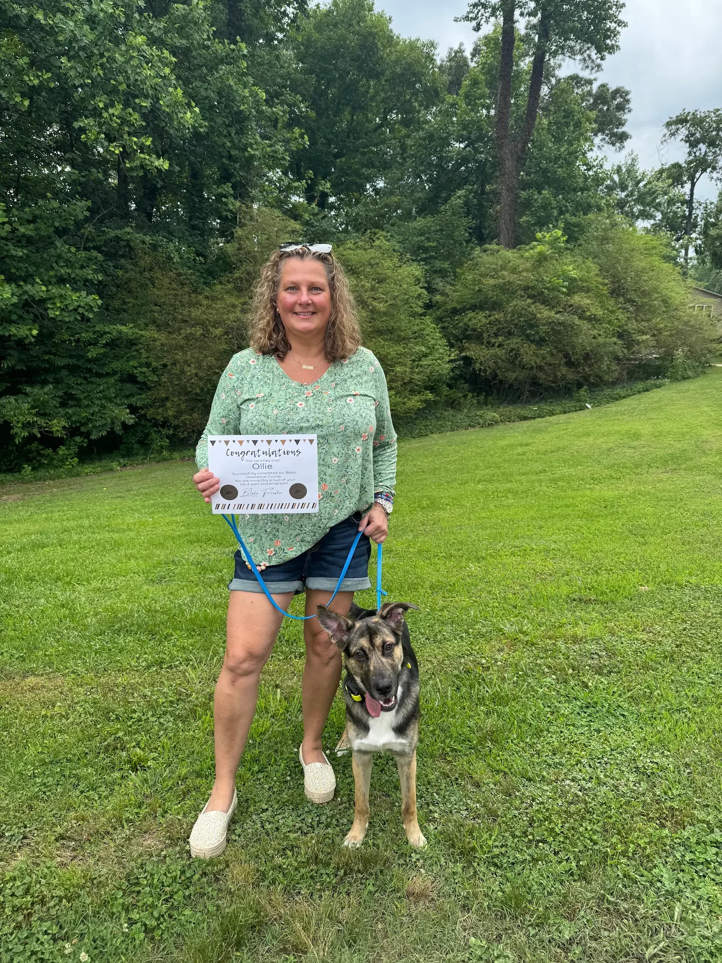 Dog owner and graduate of the Iron Paw K9 Board & Train program with graduation certificate in Hall County, GA.