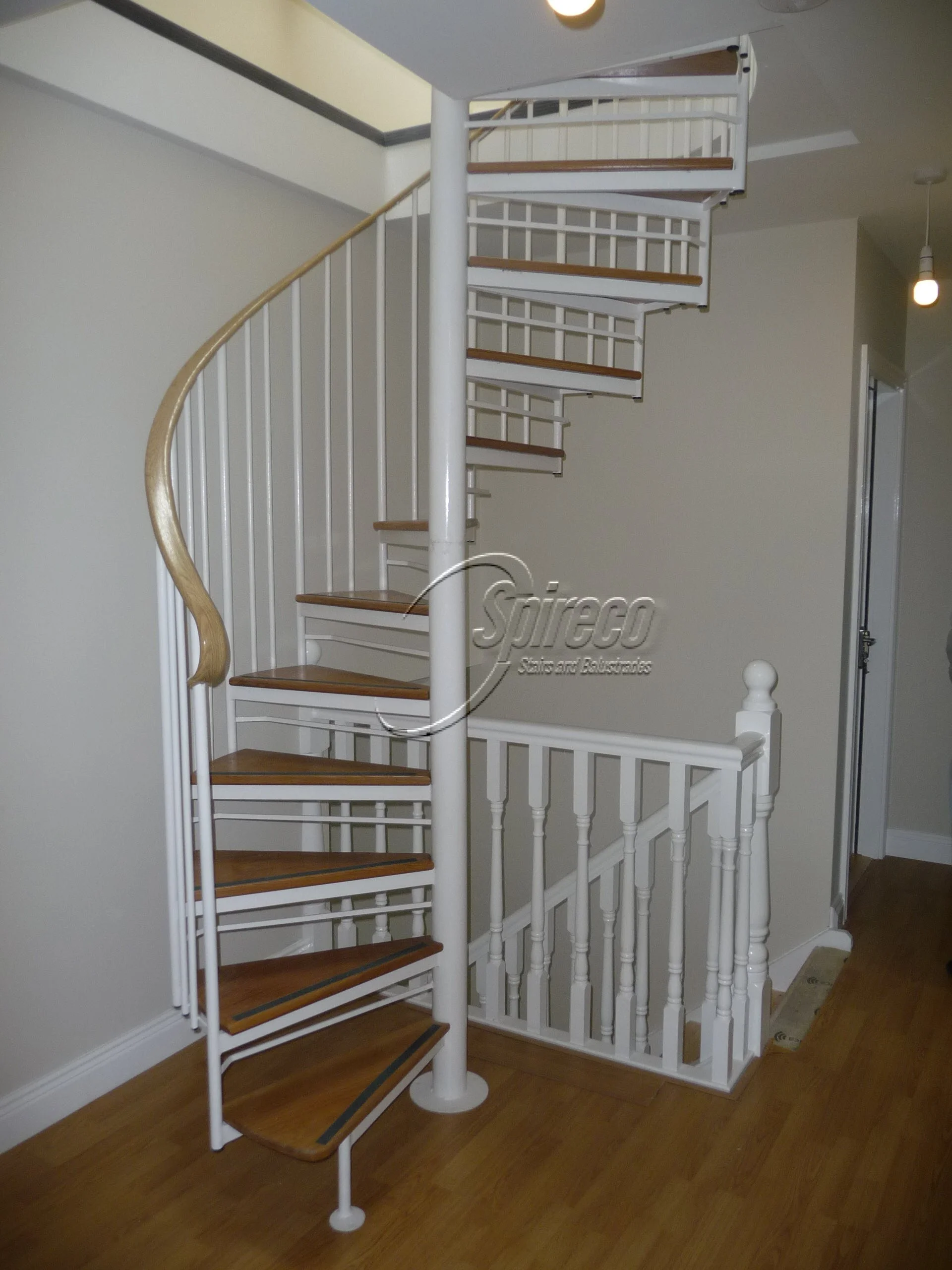 ‘Violet Hill’ Executive Spiral Stairs.
White ‘ Executive’ model Spiral Stairs with Iroko Treads.