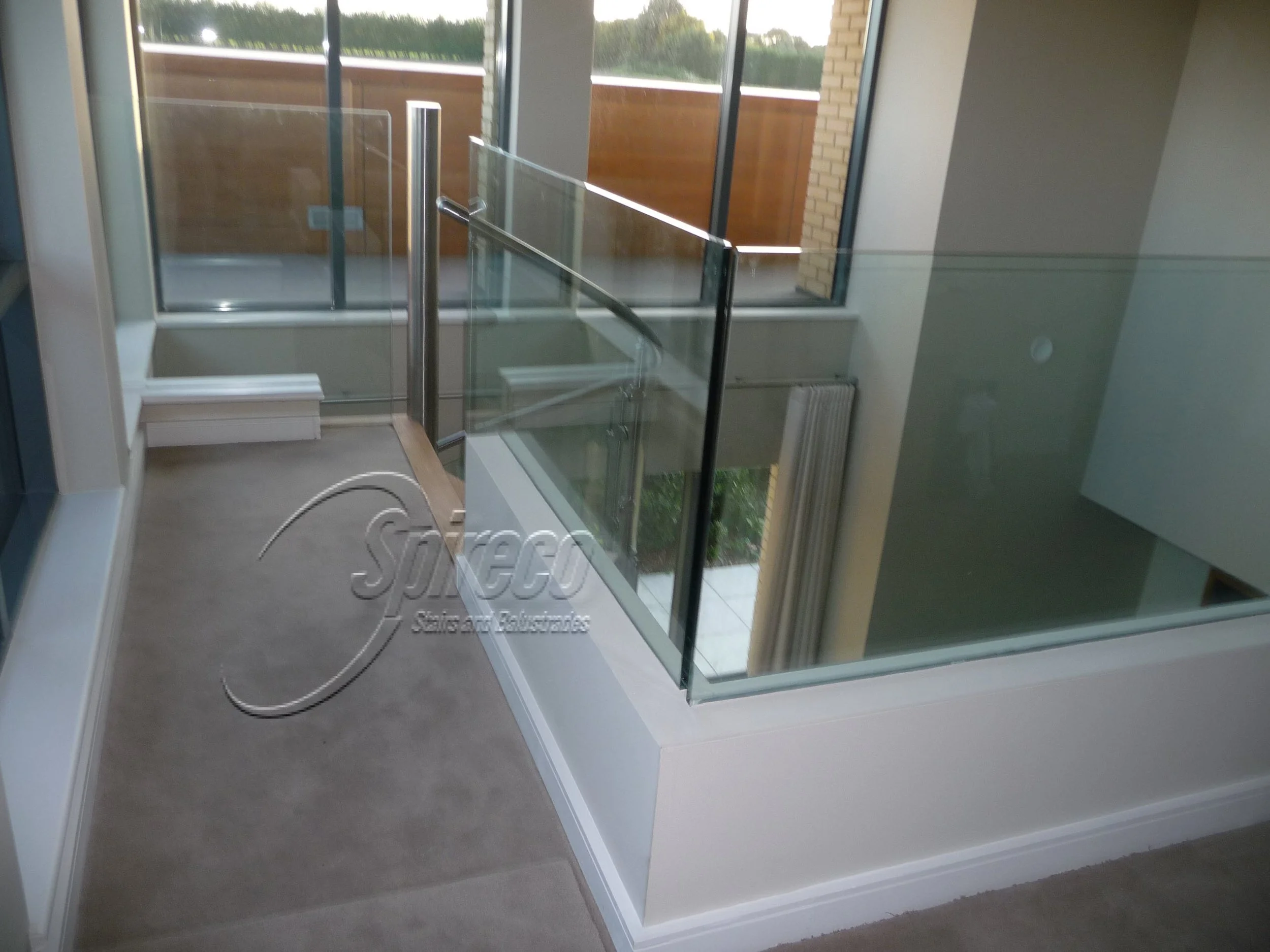 ‘Myra’ Glass Balustrade.
Toughened Cantilever Glass Balustrade with dwarf stud wall covering steel connections.