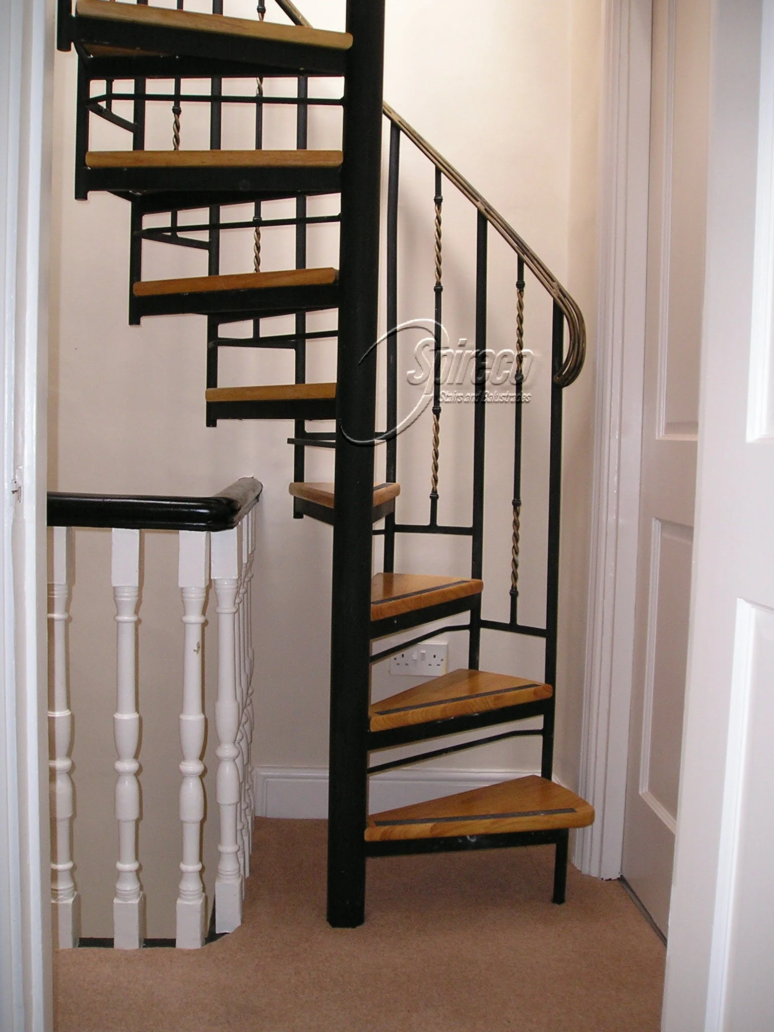 ‘Victorian’ Spiral Stairs.
Wrought Iron Handrail and Balustrade with Hardwood Treads.