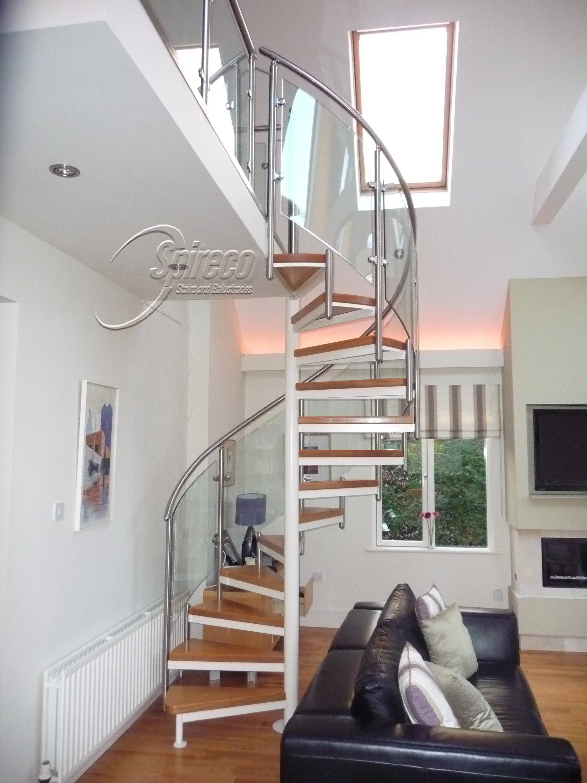 ‘Ballaly’ Orbital Spiral Stairs.
Orbital ‘ style Spiral Stairs with Curved Glass Balustrade and Stainless Steel Handrail.
