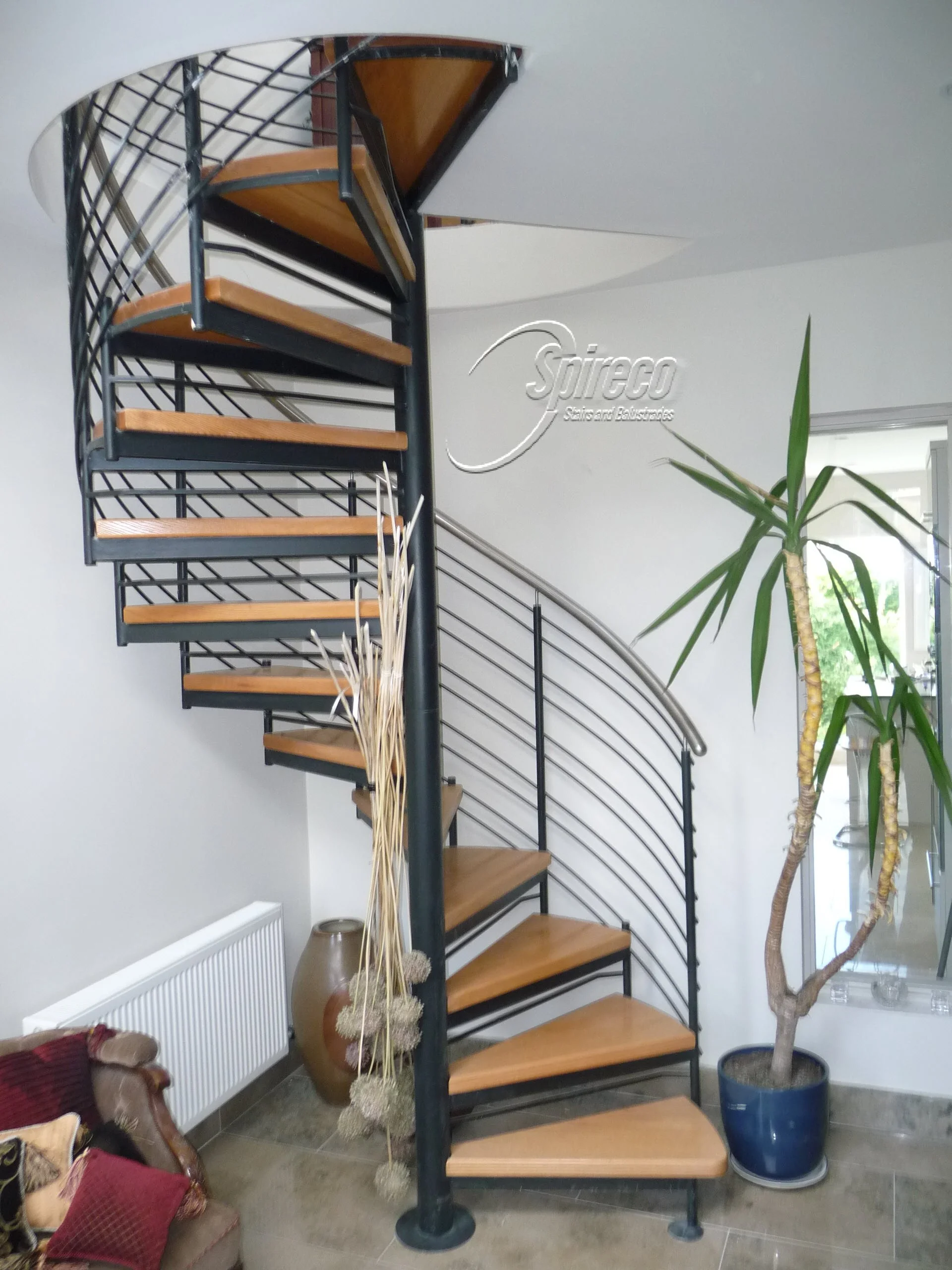 ‘St Fintans’ Helix with Stainless Steel handrail.
‘Helix’ style Spiral Stairs with Stainless Steel Handrail and 2″ Oak Treads.