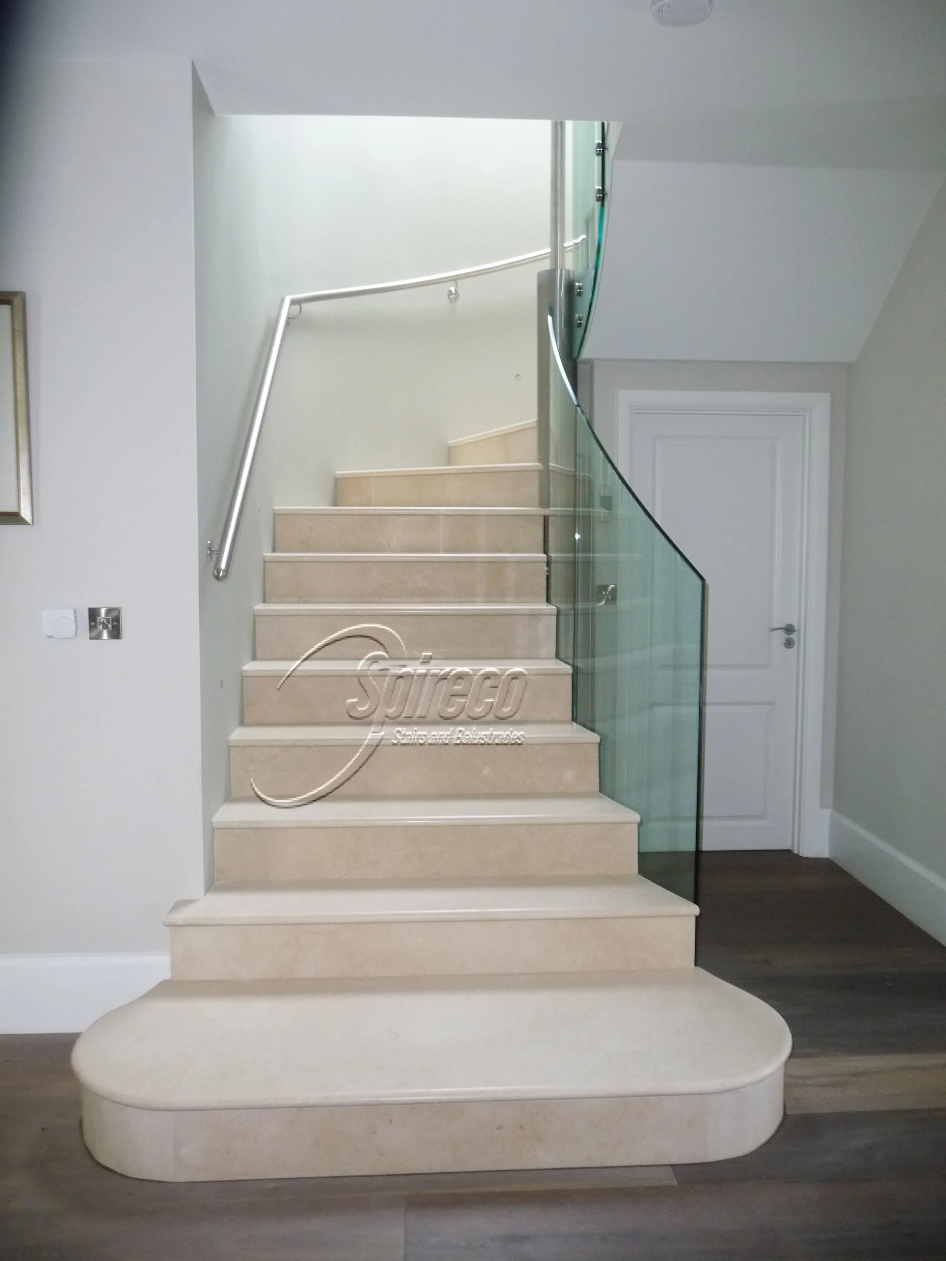 Marble Clad Stairs with Glass Balustrade.
Steel Framed Curved Stairs Clad in Marble with Side Mounted Cantilevered Glass Balustrade. Click on ‘Latest News’ for more this Stairs.