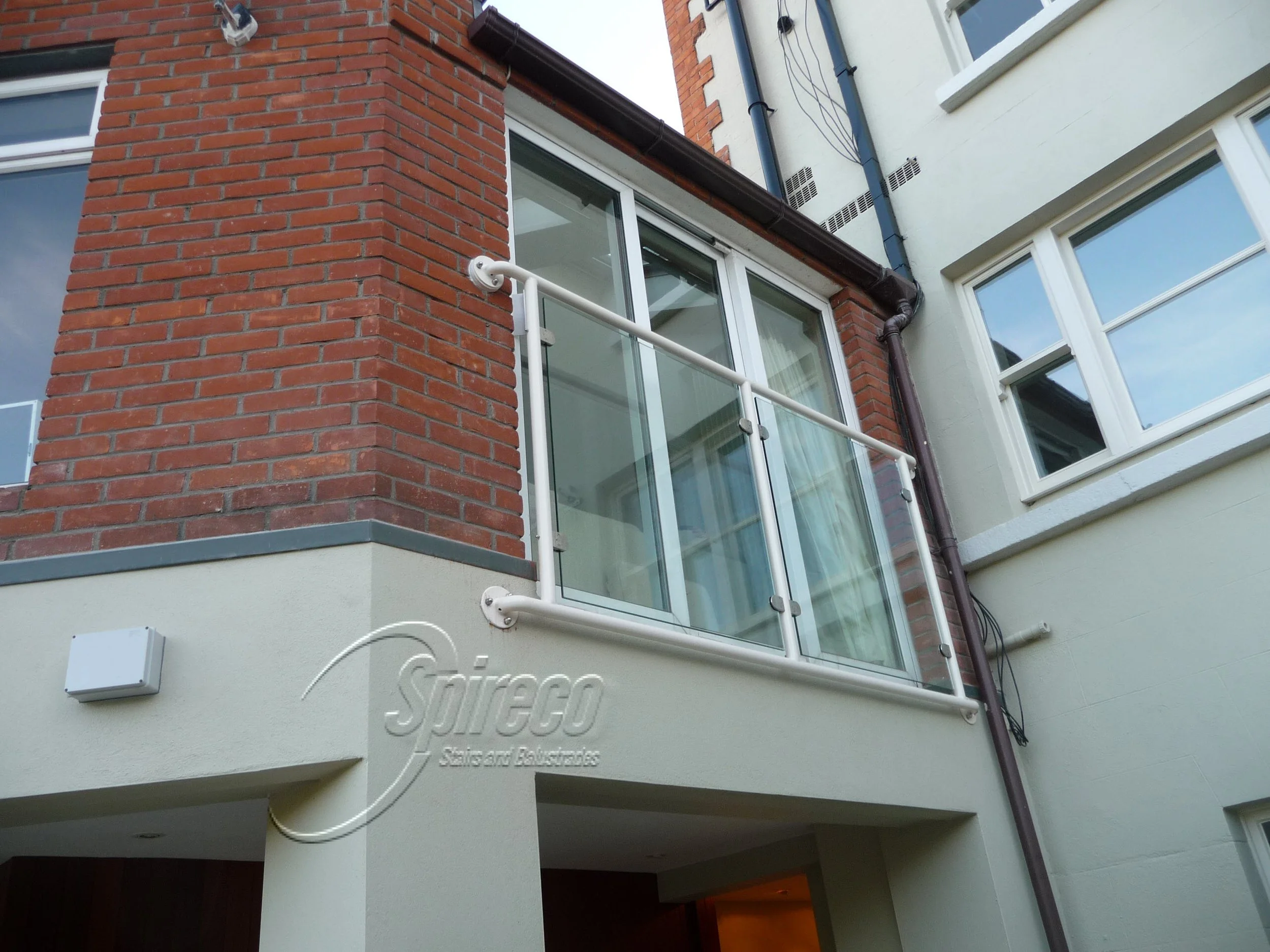 Galvanised and Sprayed metal framed 'Juliet Balcony' with glass infill panels.