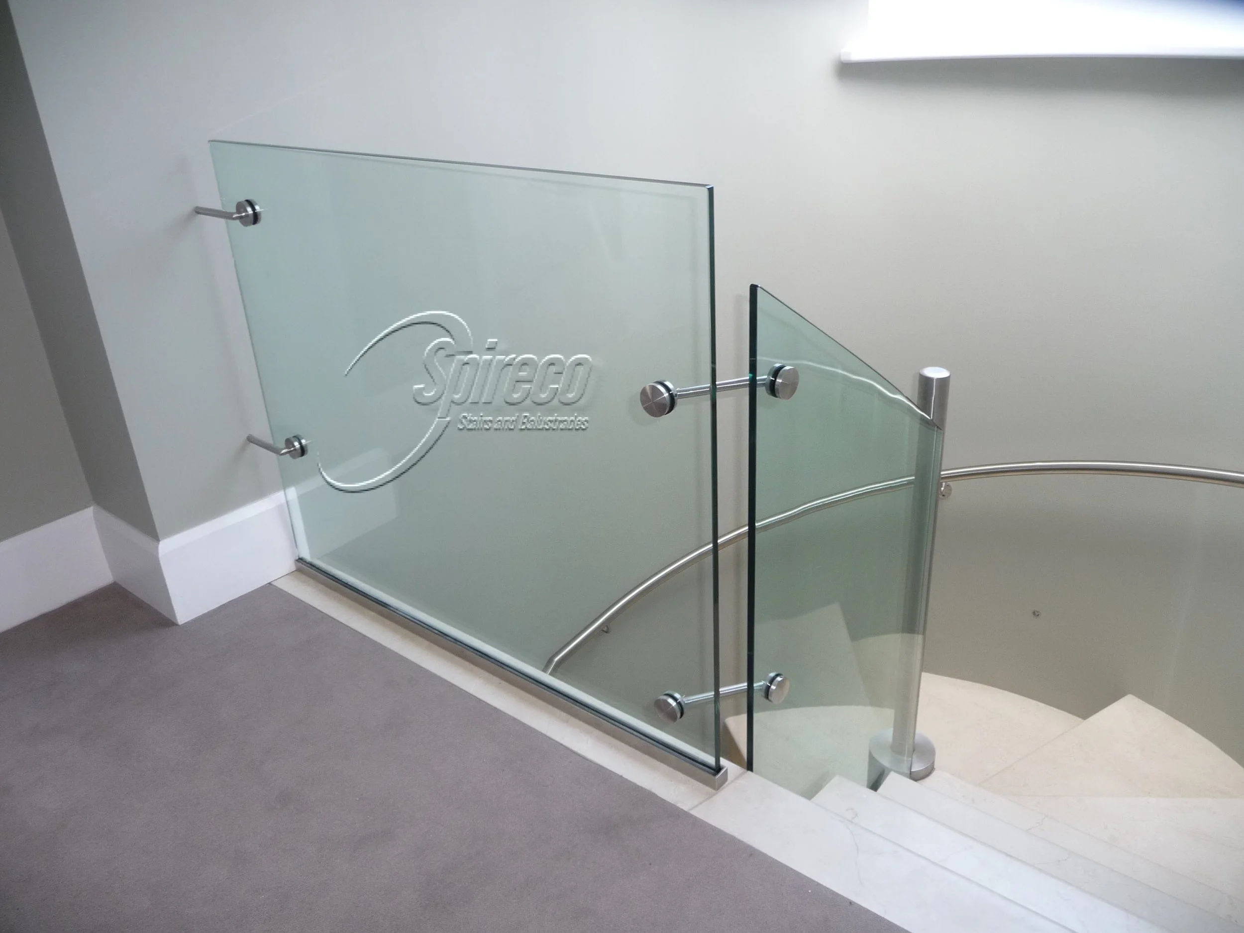 ‘Delargy’ Glass Balustrade.
Toughened Glass Balustrade set in Stainless Steel Channel with ‘thru glass’ Stainless Steel Disc Connectors.