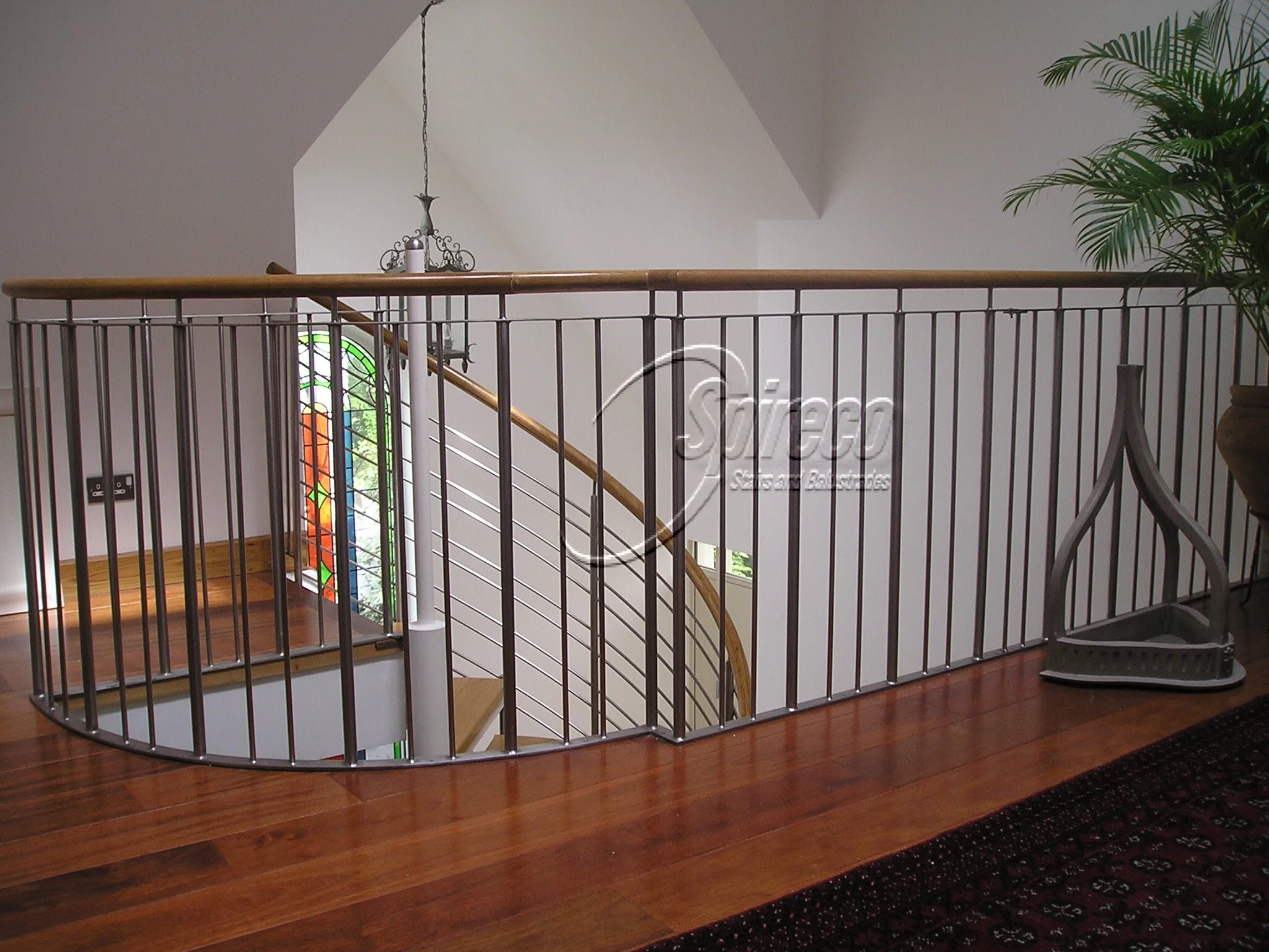 ‘Tradewinds’ Stainless Steel Balustrade.
Polished Stainless Steel Balustrade with Circular Oak Handrail.