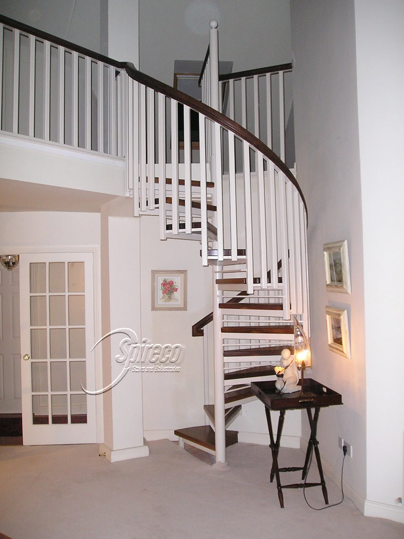 ‘Marina’ Spiral Stairs.
Steel framed Spiral Stairs with Square Spindle Balustrade and Mahogany Handrail & 2″ thick Mahogany Treads.