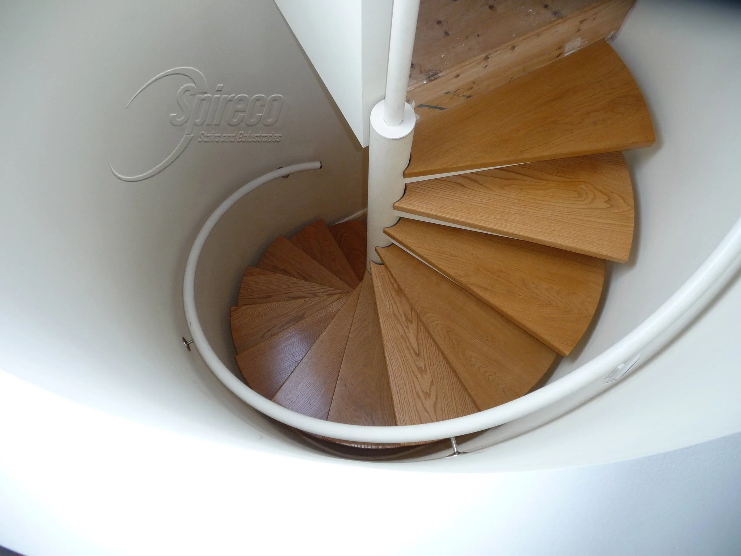 Wall-mounted Tubular Steel Spiral Handrail.
Wall-mounted Tubular Steel Spiral Handrail and Steel framed Spiral Stairs with tapered tray supports for choice of 2″ Hardwood Treads.