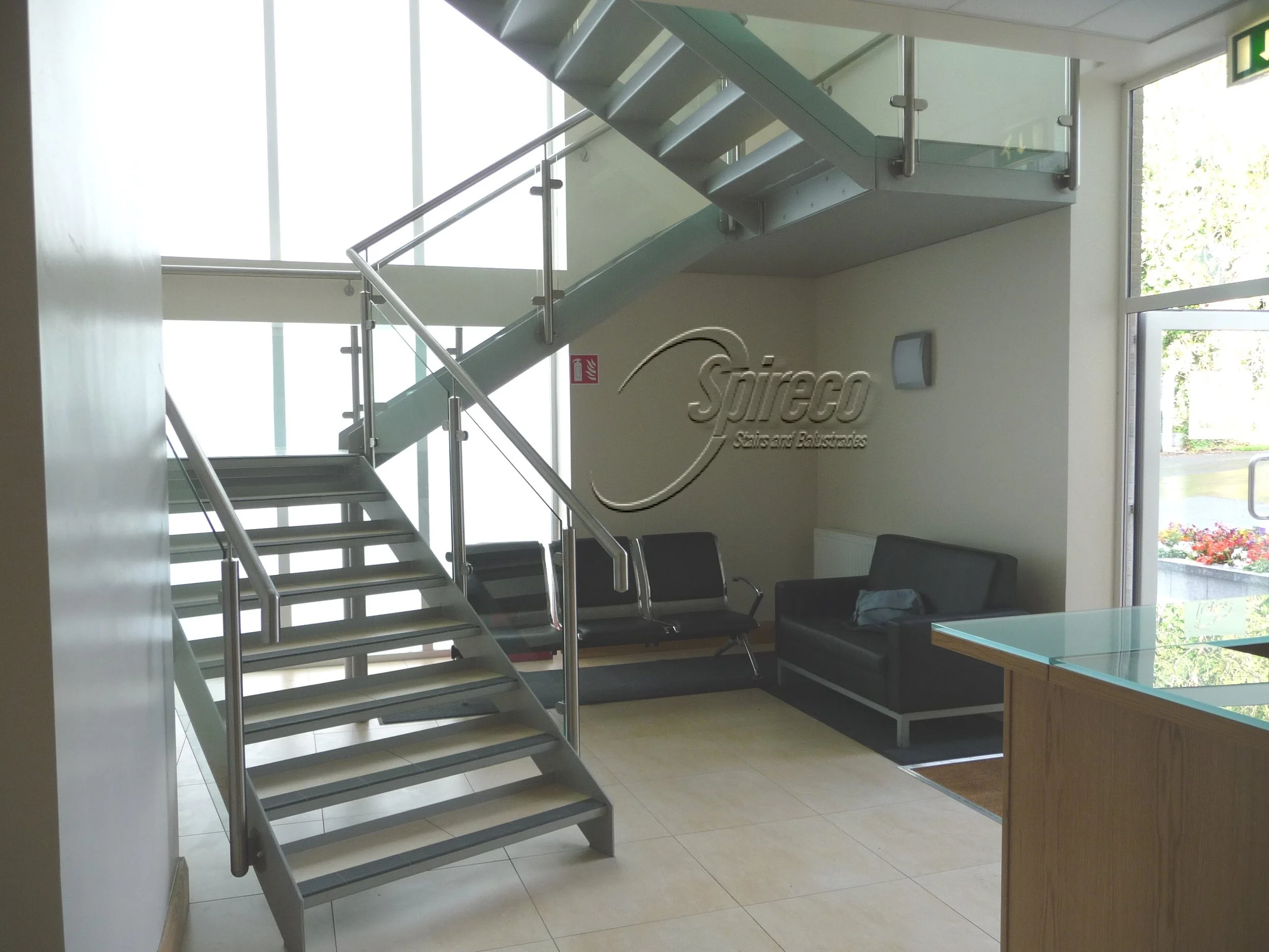 ‘Tile Inlay’ Stairs.
Steel framed, side string stairs with tile inlay in steel tray tread and Stainless Steel & Glass Balustrade.