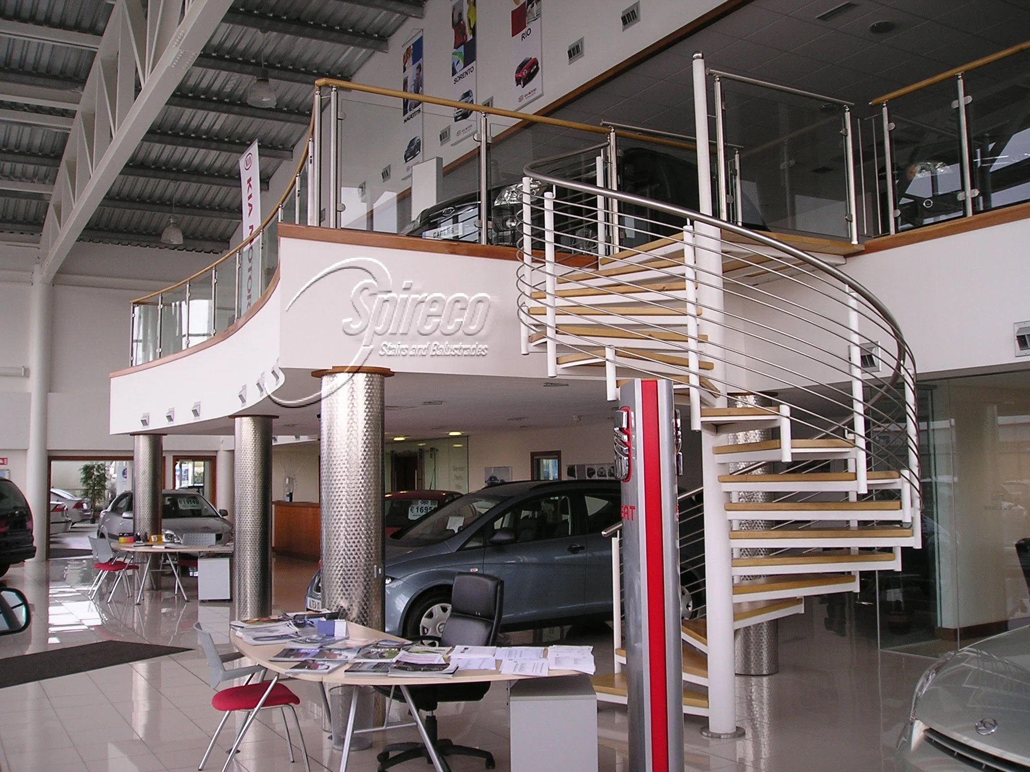 ‘Tom Walsh Motors’ Slipstream.
‘Slipstream’ Spiral Stairs with Curved Timber Handrail on Stainless Steel Posts with Toughened Glass infill to Mezzanine.