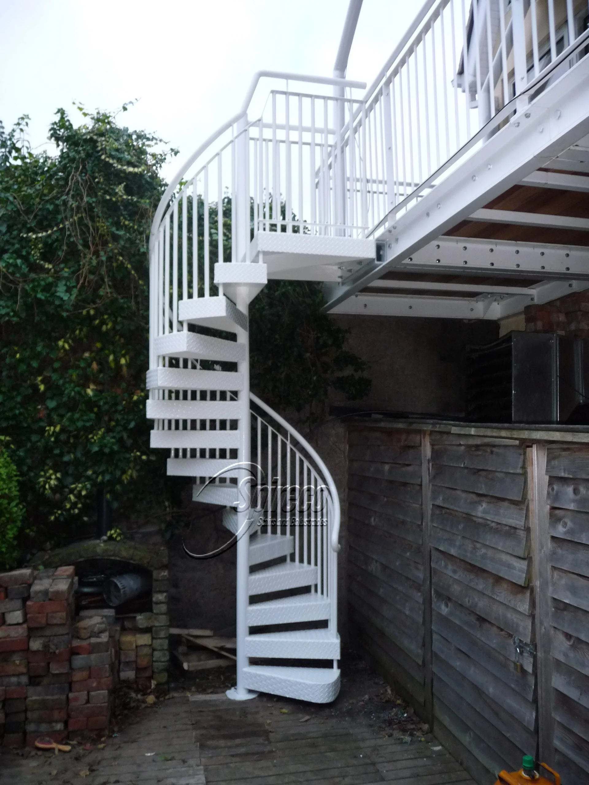 White Powder-Coated Spiral Stairs.
White Powder-coated Spiral Stairs with Chequer Plate Treads & Landing and Tubular Steel Handrail.