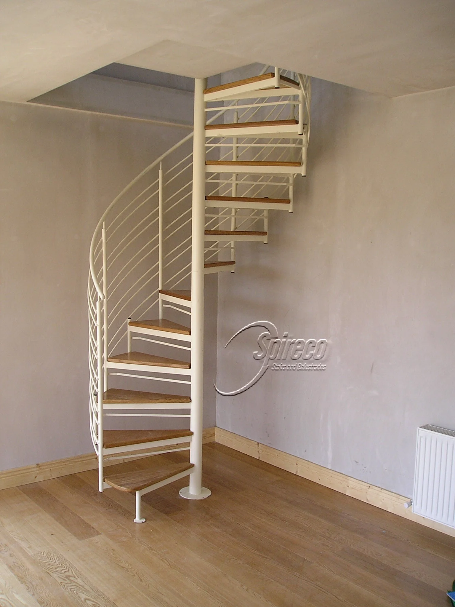 ‘Lissadell Slipstream’ Spiral Stairs.
‘Slipstream’ model Spiral Stairs with Stainless Steel Handrail and Rod Balustrade and 2″ thick Oak treads.