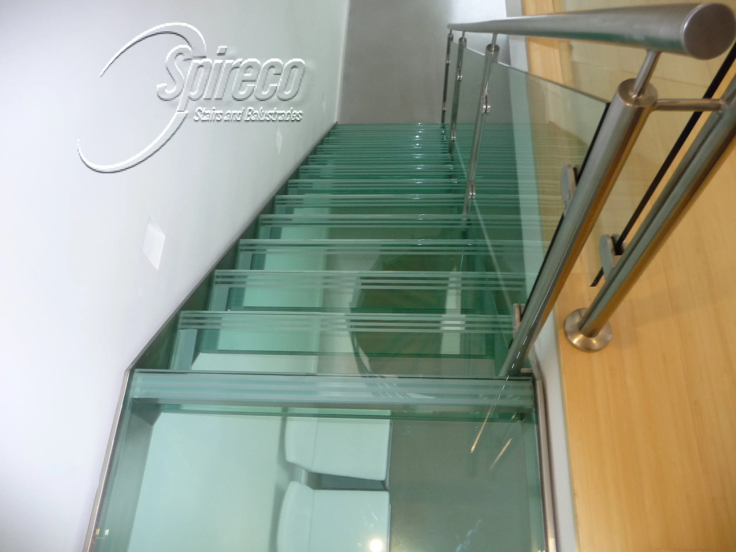 Glass Treaded Stainless Steel Stairs–Howth.
Stainless Steel String Stair with Glass Treads & landing and Stainless Steel & Glass Balustrade.