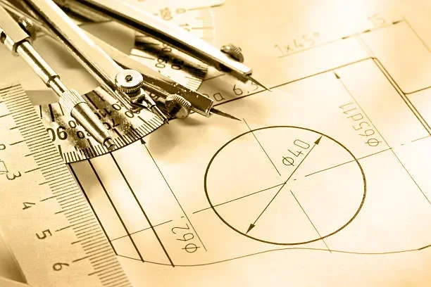 Engineering drawing with a compass, ruler, and technical diagram of a circle.
