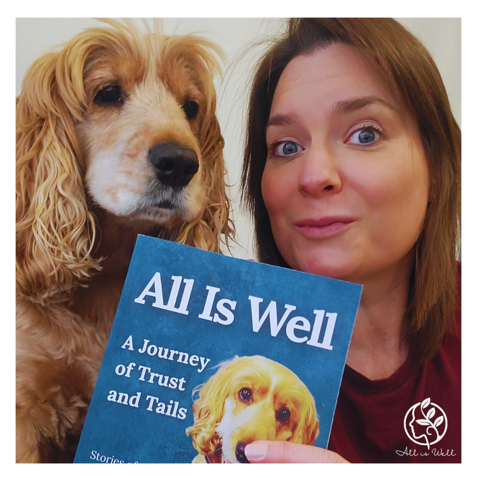 Therapy Dog Lola and Catherine Whitlow holding their book