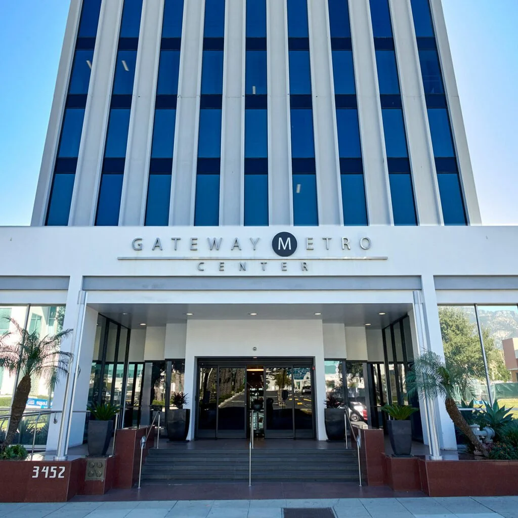 Exterior of the Gateway Metro Center with glass windows and a sign reading Gateway Metro Center above the entrance.