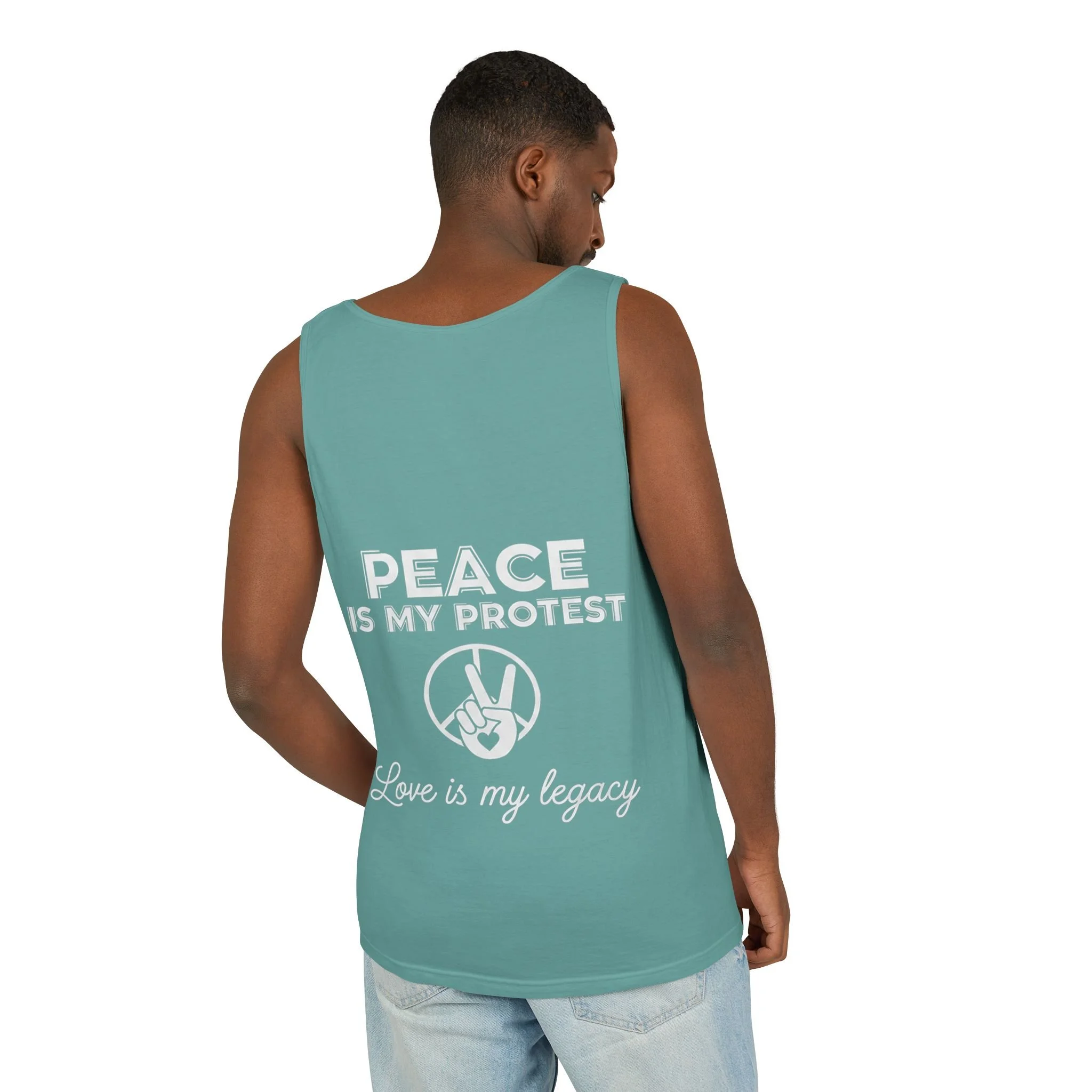 Back view of a person wearing a teal tank top with the message 'PEACE IS MY PROTEST' and 'Love is my legacy' printed on it. The tank top features a peace sign hand gesture in a circle.