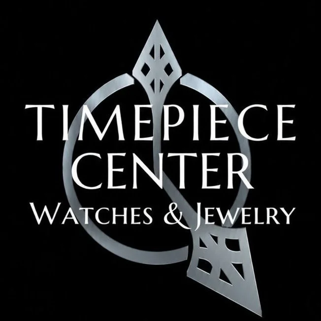 A logo for Timepiece Center Watches & Jewelry, featuring stylized geometric designs in silver on a black background.
